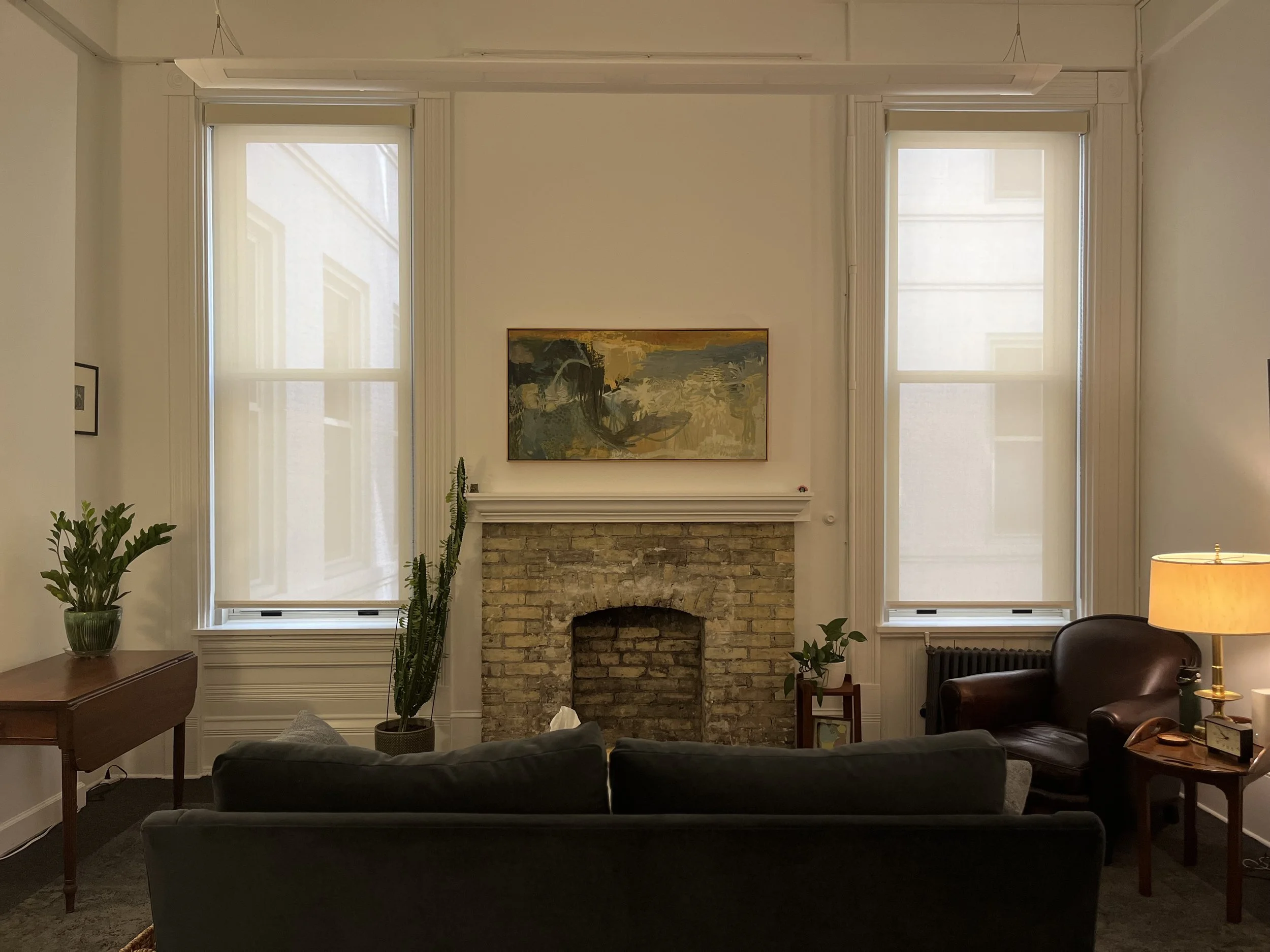 office with couch and fireplace