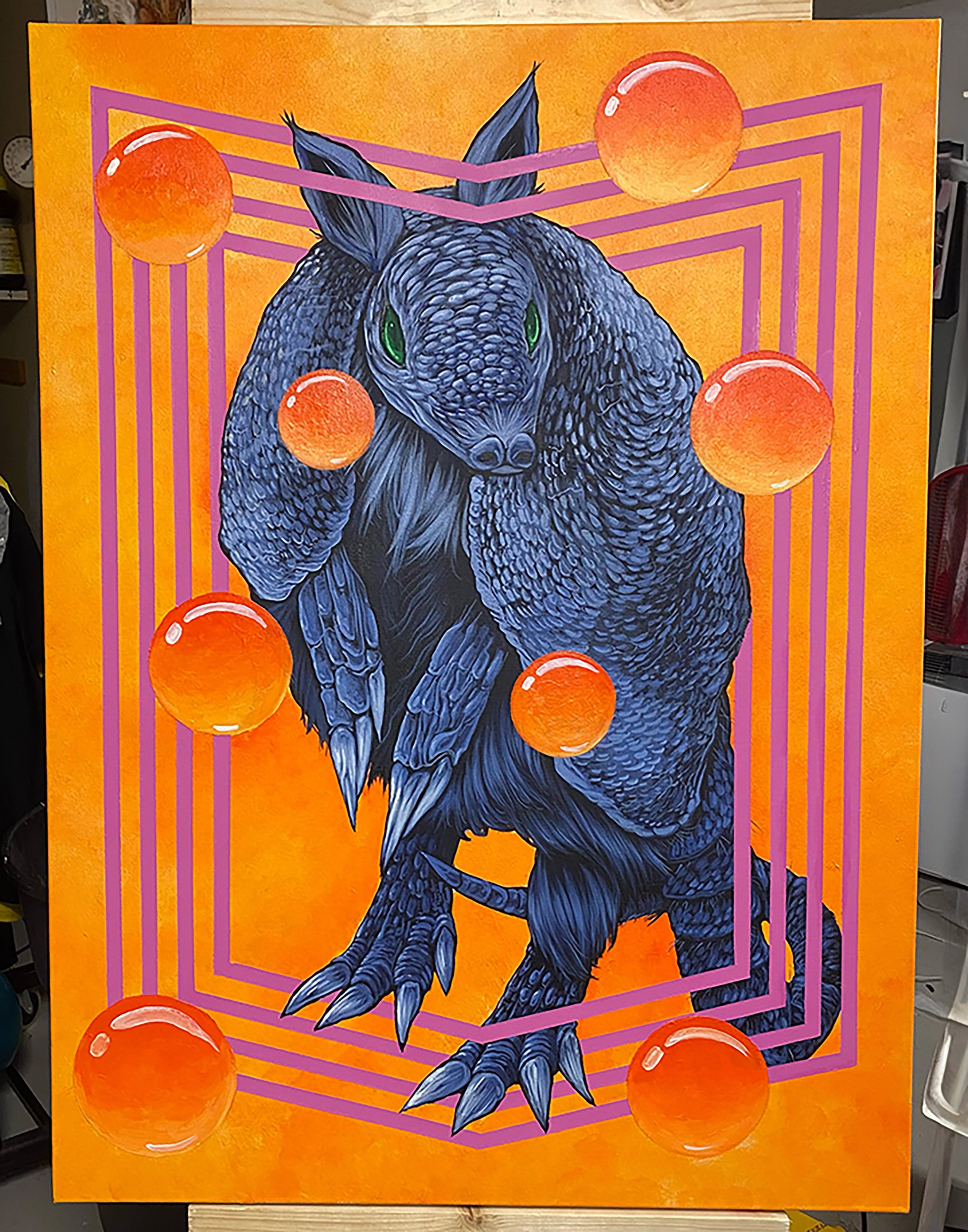 A colorful painting of a black dragon with green eyes on an orange background, surrounded by pink geometric lines and orange spheres.