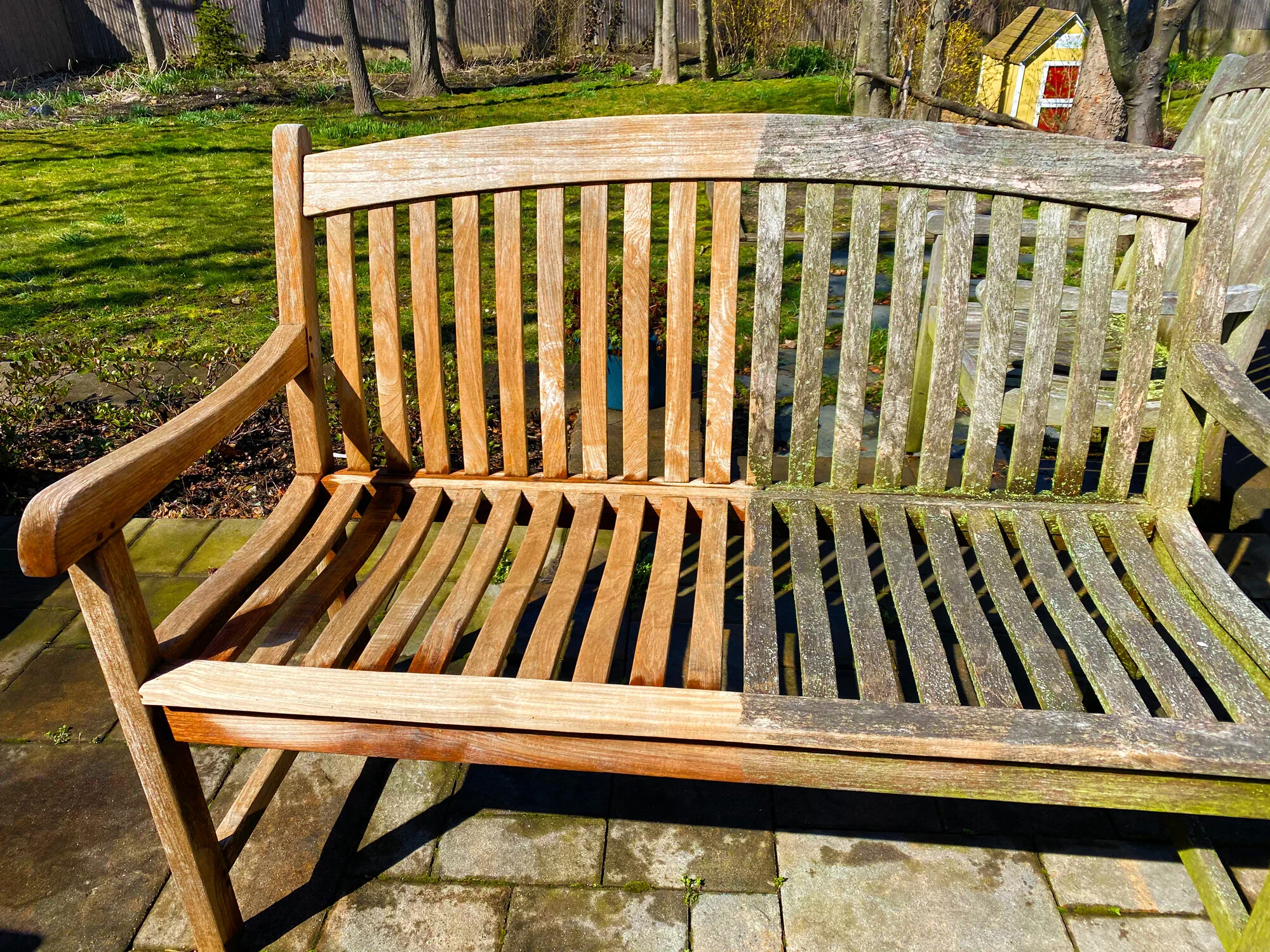 A before and after comparison photo of an outdoor wooden bench that was badly weathered and mossy and now looks like new after an M & M ProWash professional soft wash power washing exterior cleaning service for mold, mildew and algae removal.