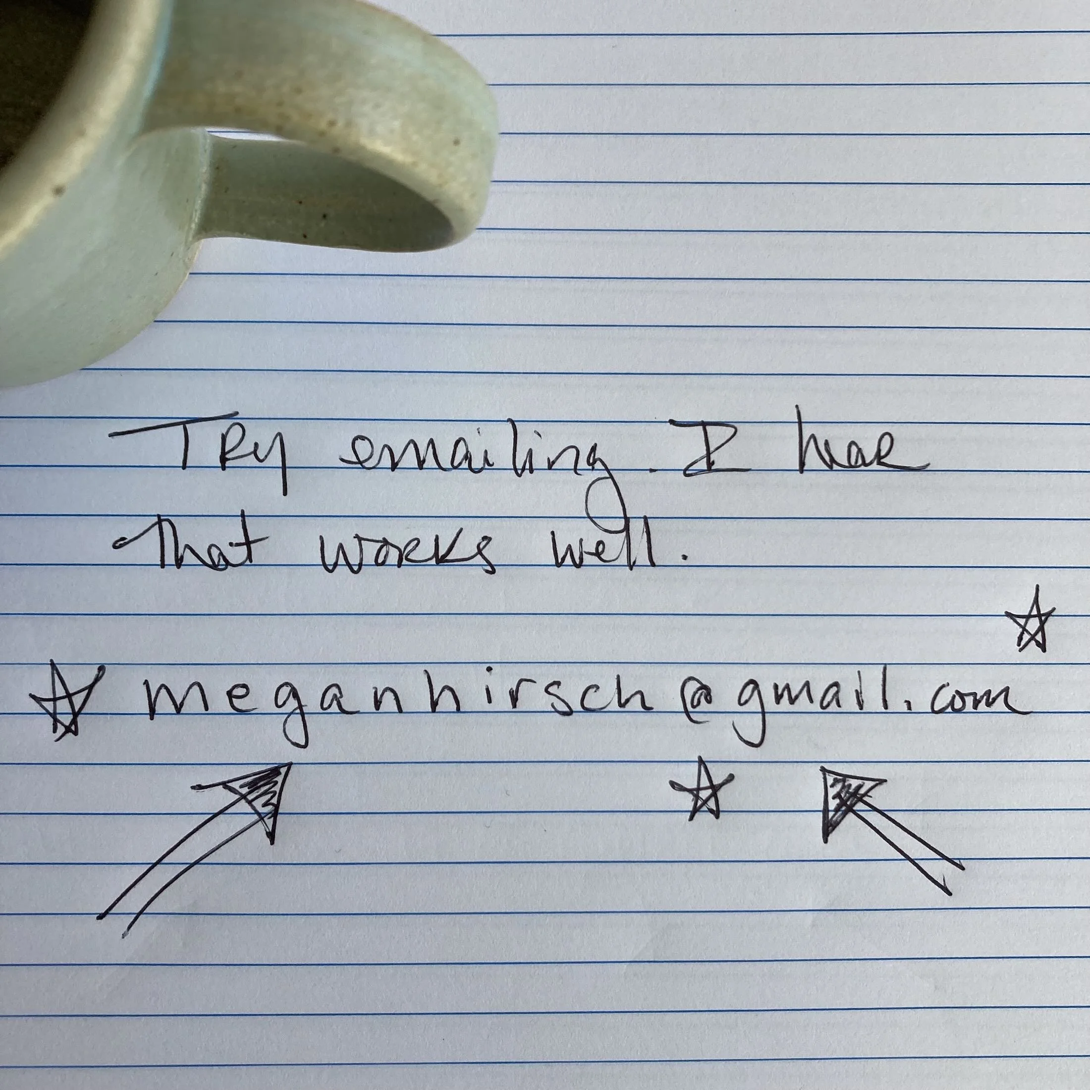 A handwritten note on lined paper that says, "Try emailing. I hear that works well." with an email address, and some decorative stars and arrows drawn around the email address indicating how to get in touch with author Megan Hirsch.