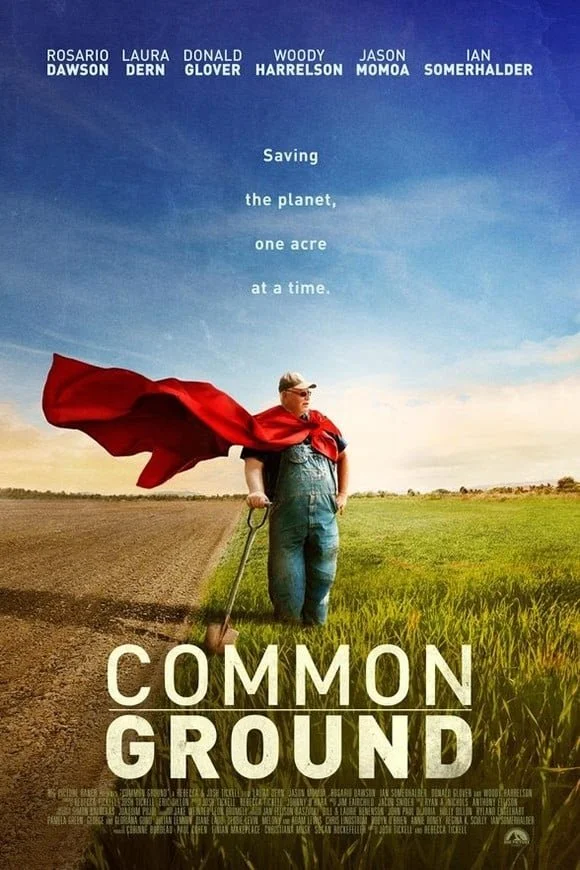 A man stands in a field with half farmland and half grass, holding a shovel. He wears a red cape and sunglasses. The sky is partly cloudy with blue and orange hues. The text at the top lists actor names, and the title "Common Ground" is at the bottom, with a tagline about saving the planet one acre at a time.