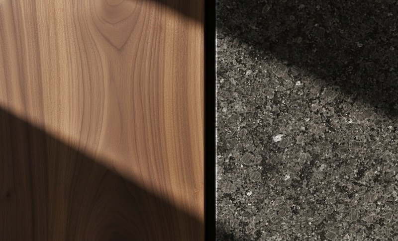 A close-up of wood and stone meeting at a clean architectural joint, symbolizing the integration of different perspectives during a relationship disagreement.