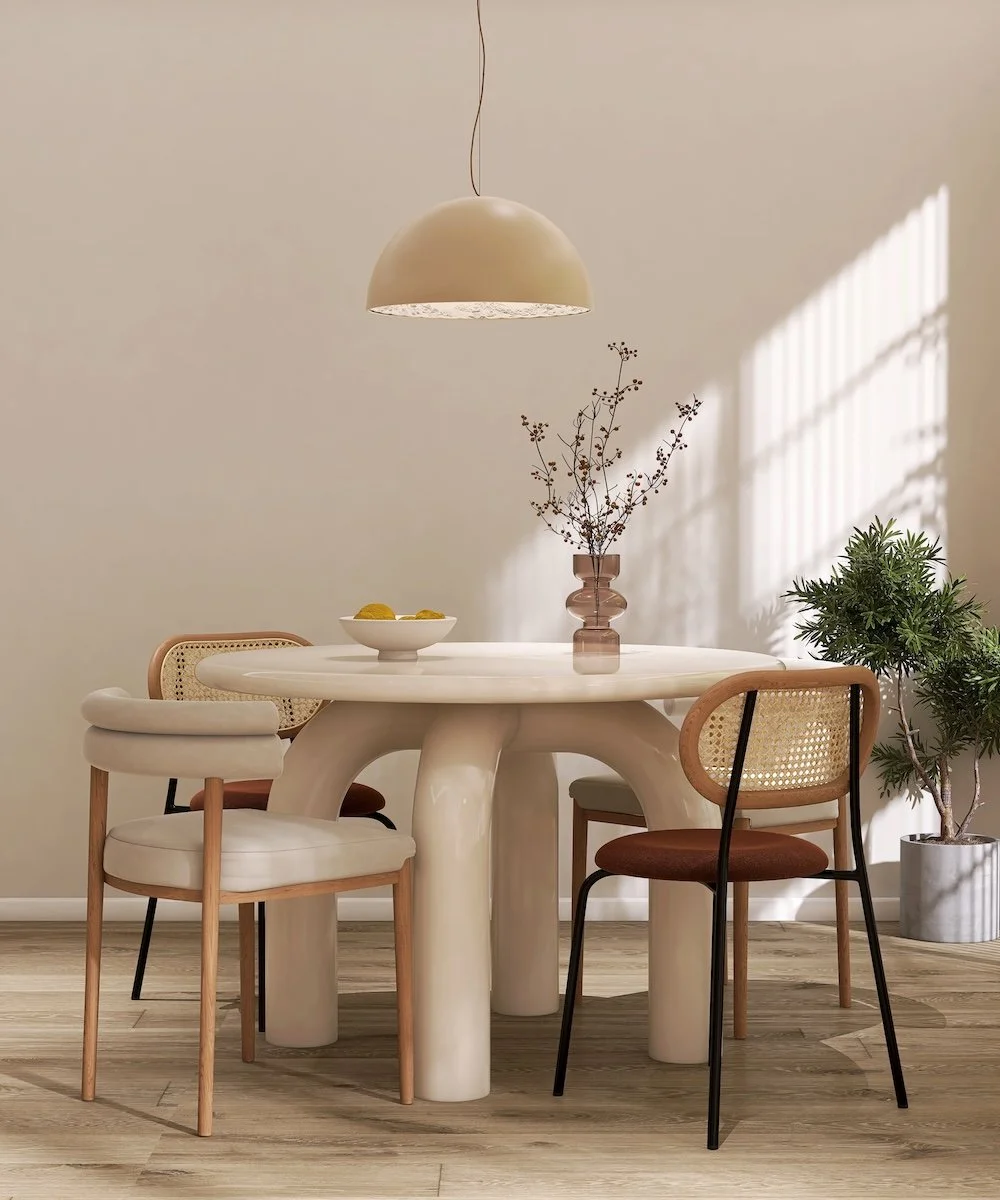 A modern round table with three chairs, symbolizing the benefit of good design.