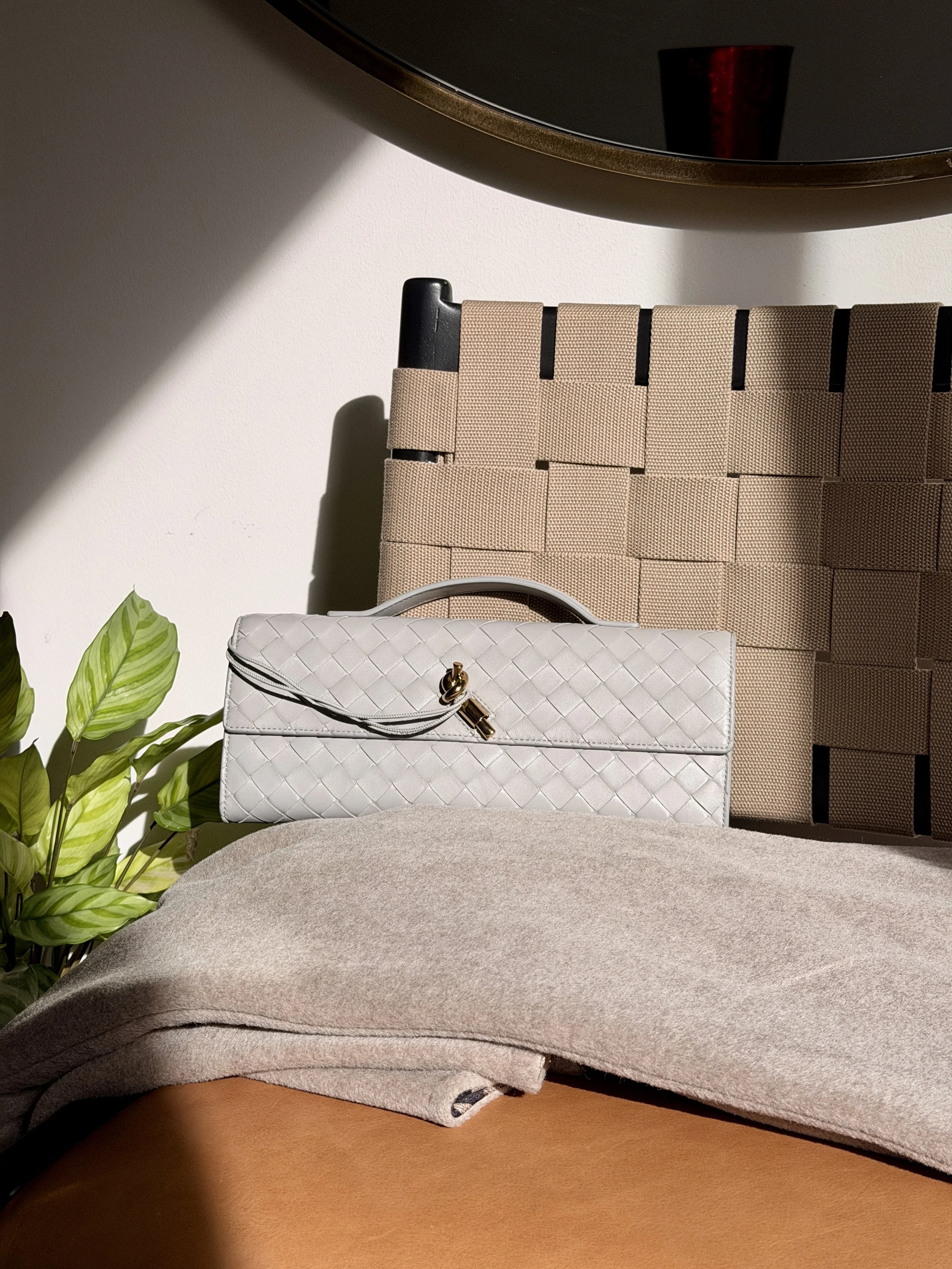 Close up photo of Bottega Veneta Andiamo Clutch.