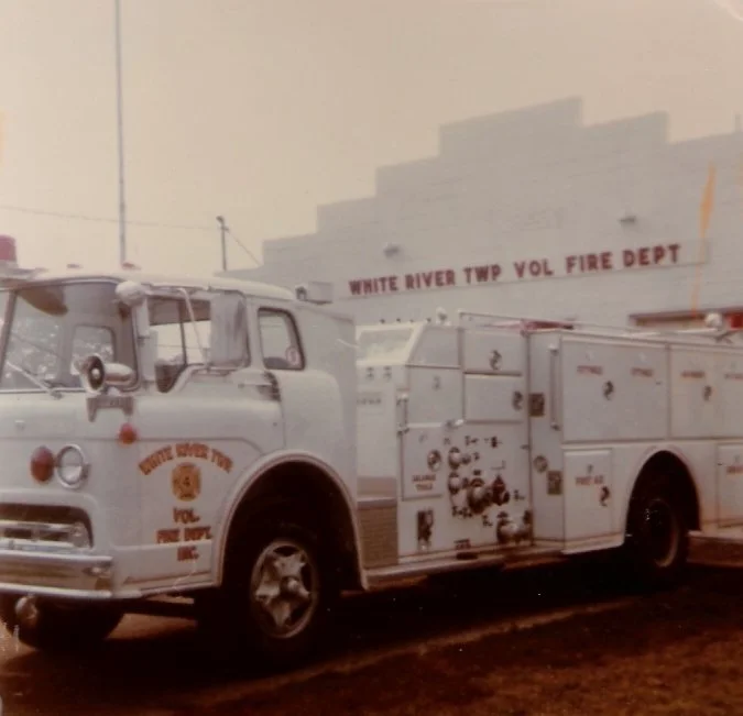 White River Township Volunteer Fire Department fire truck parked outside a building.