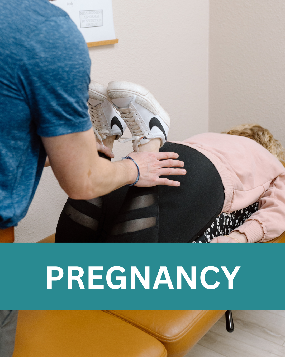 A pregnant woman lying face down on a medical examination table, receiving chiropractic treatment for pregnancy discomfort, with a healthcare worker evaluating her leg lengths and muscle tension.