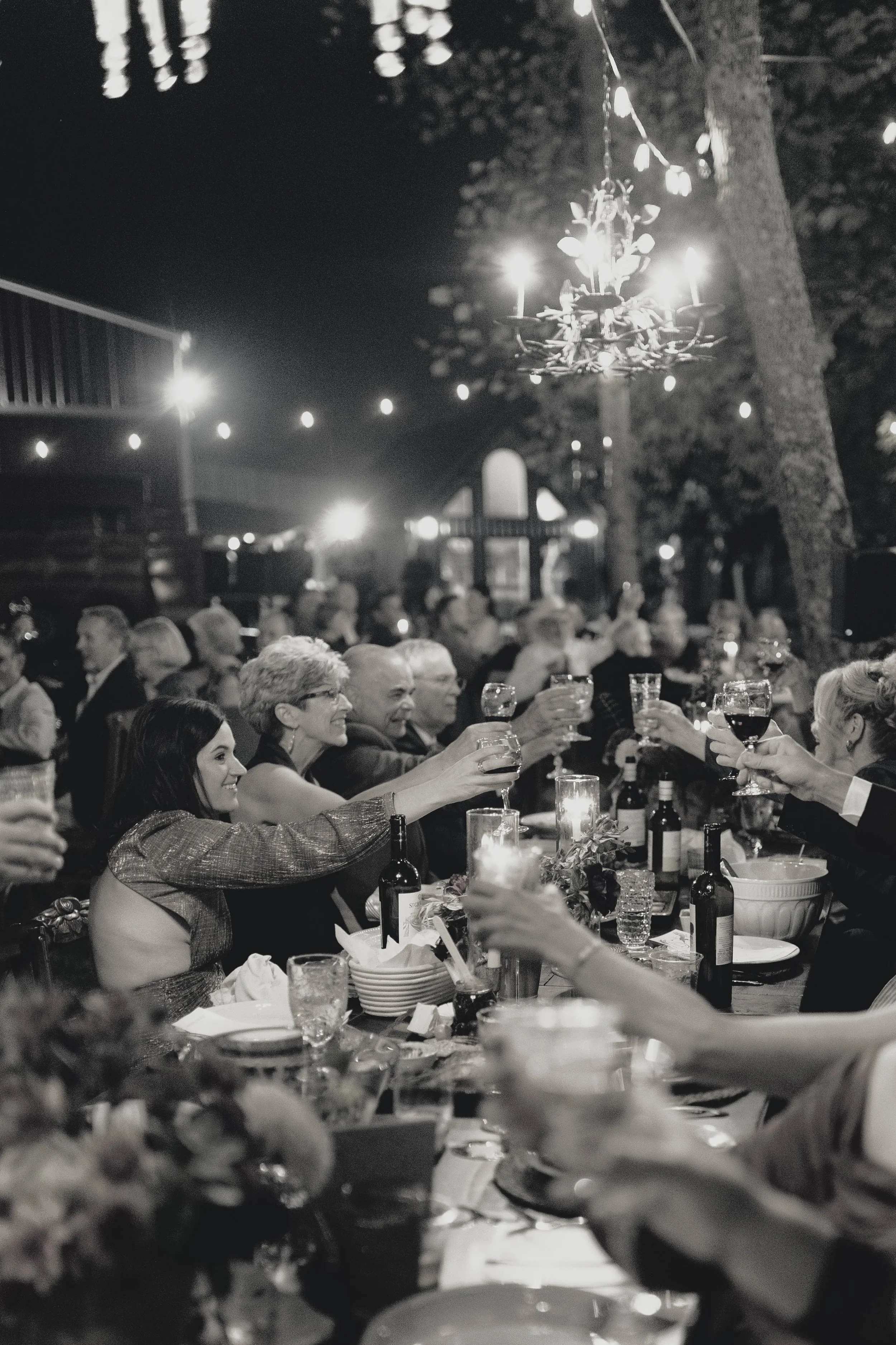 Elegant kentucky wedding reception guests at dinner under chandeliers
