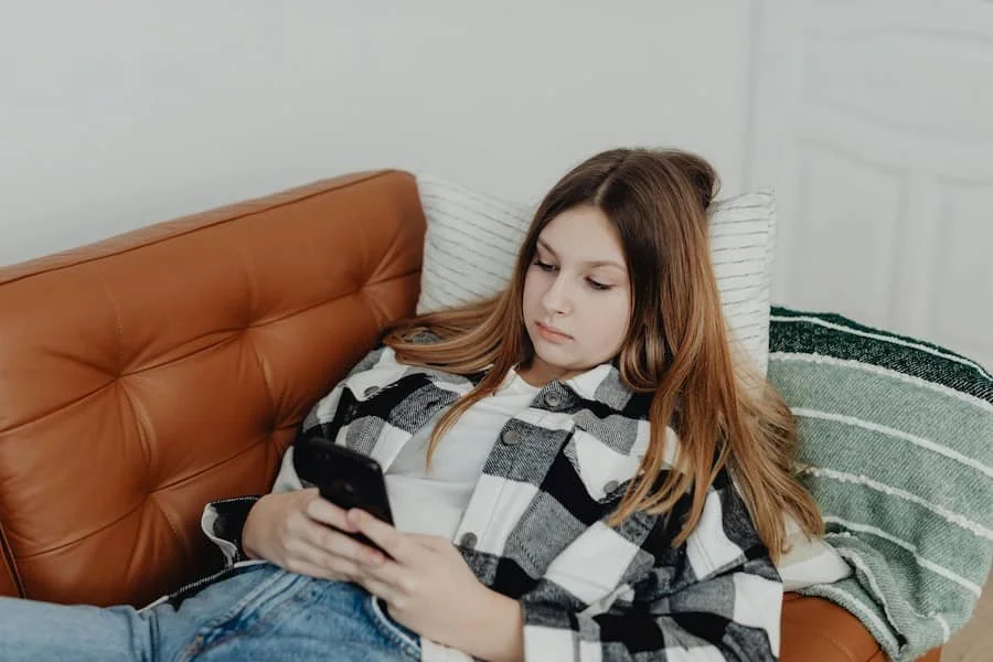 girl scrolling on phone