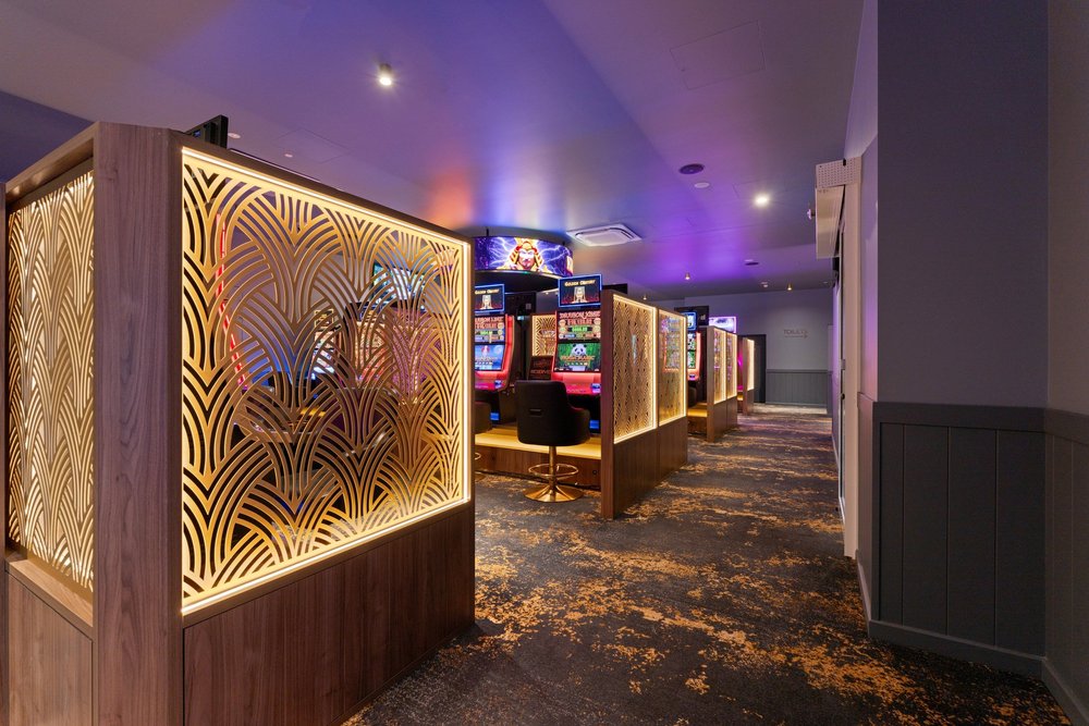 Gaming room with lit timber screens, The Fairfield Hotel