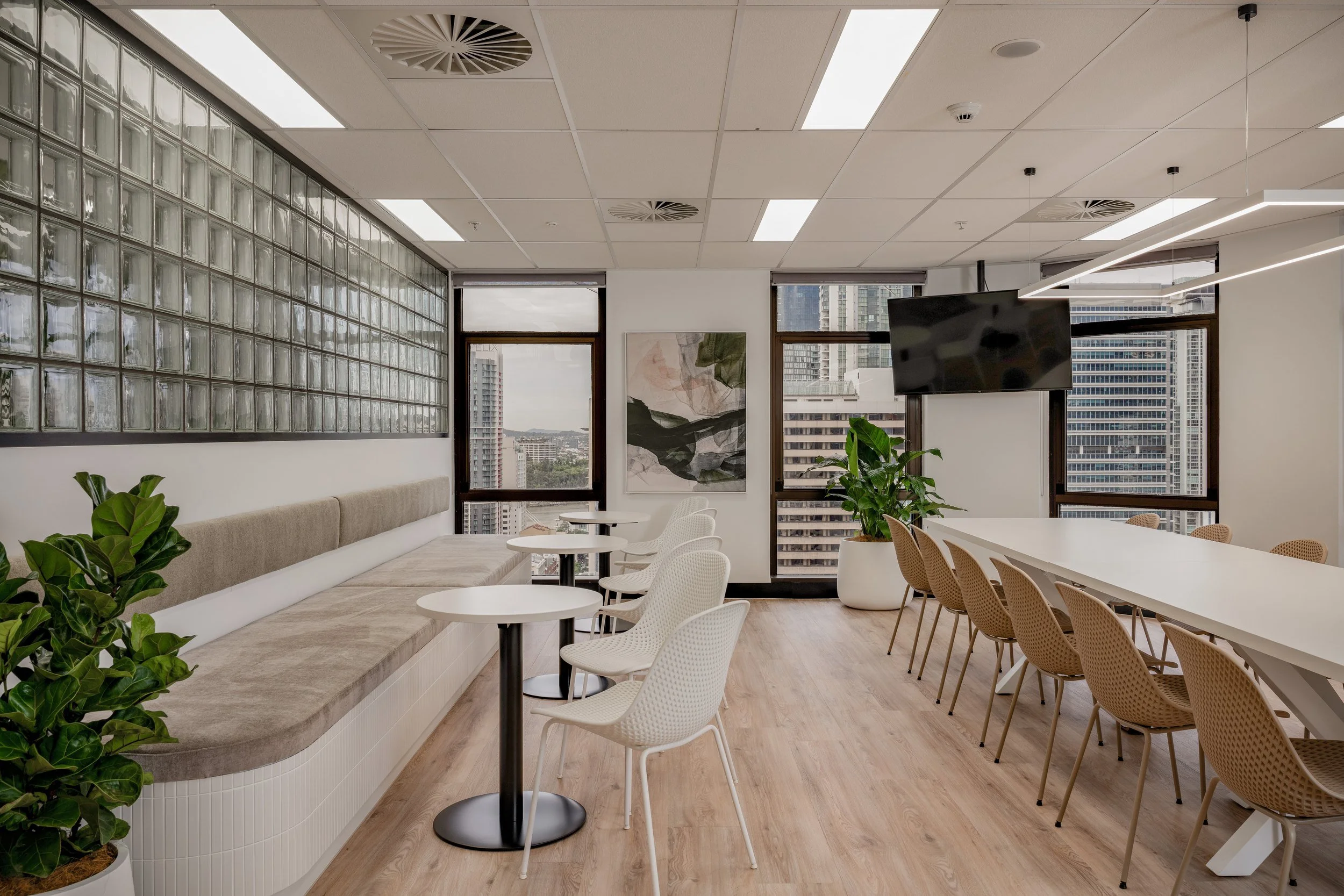 Glass brick wall and kitchen at Level 20, 288 Edward Street, Brisbane