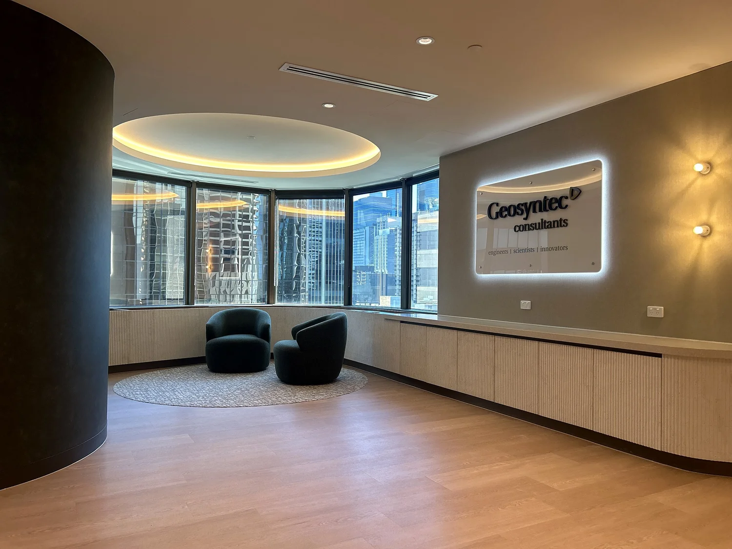 Curved reception with lit ceiling at Gold Tower, 10 Eagle Street