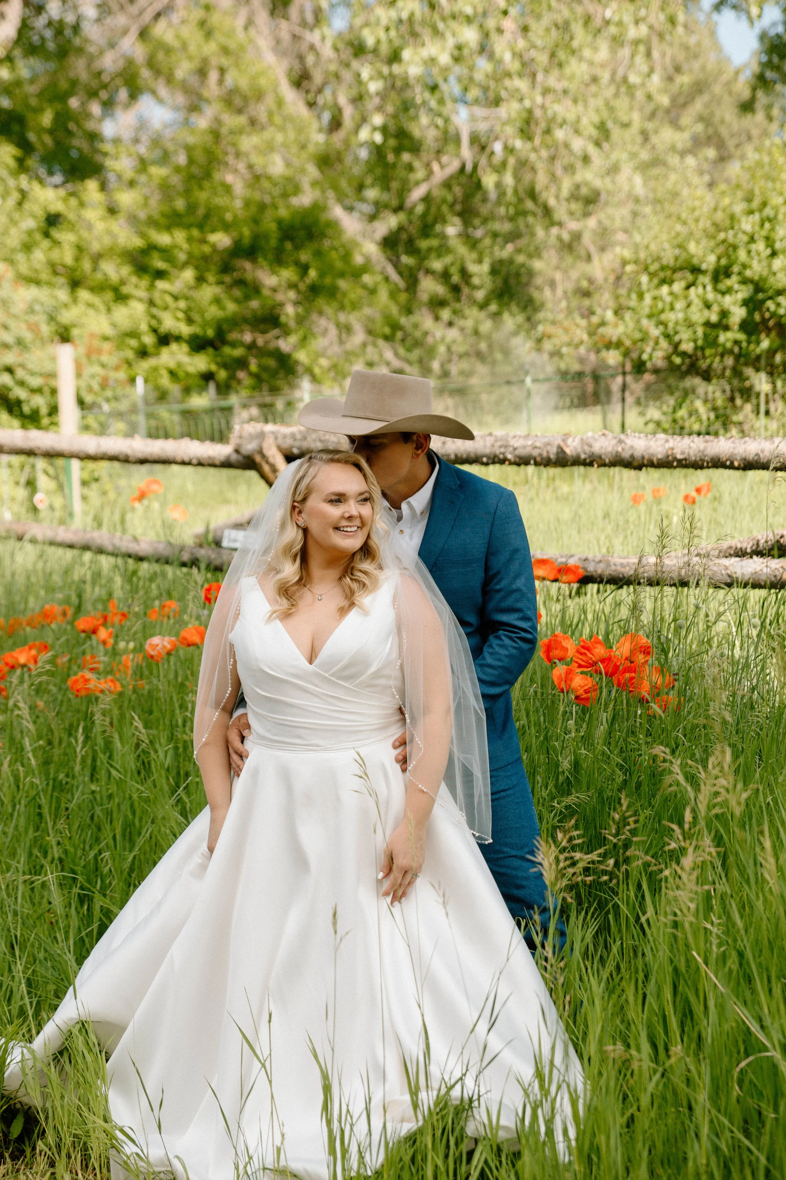 cowboy-kissing-his-bride-in-poppy-field