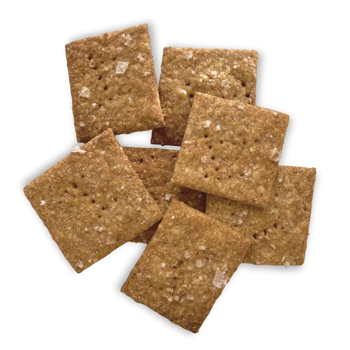 Six salted soda crackers scattered on a white background.