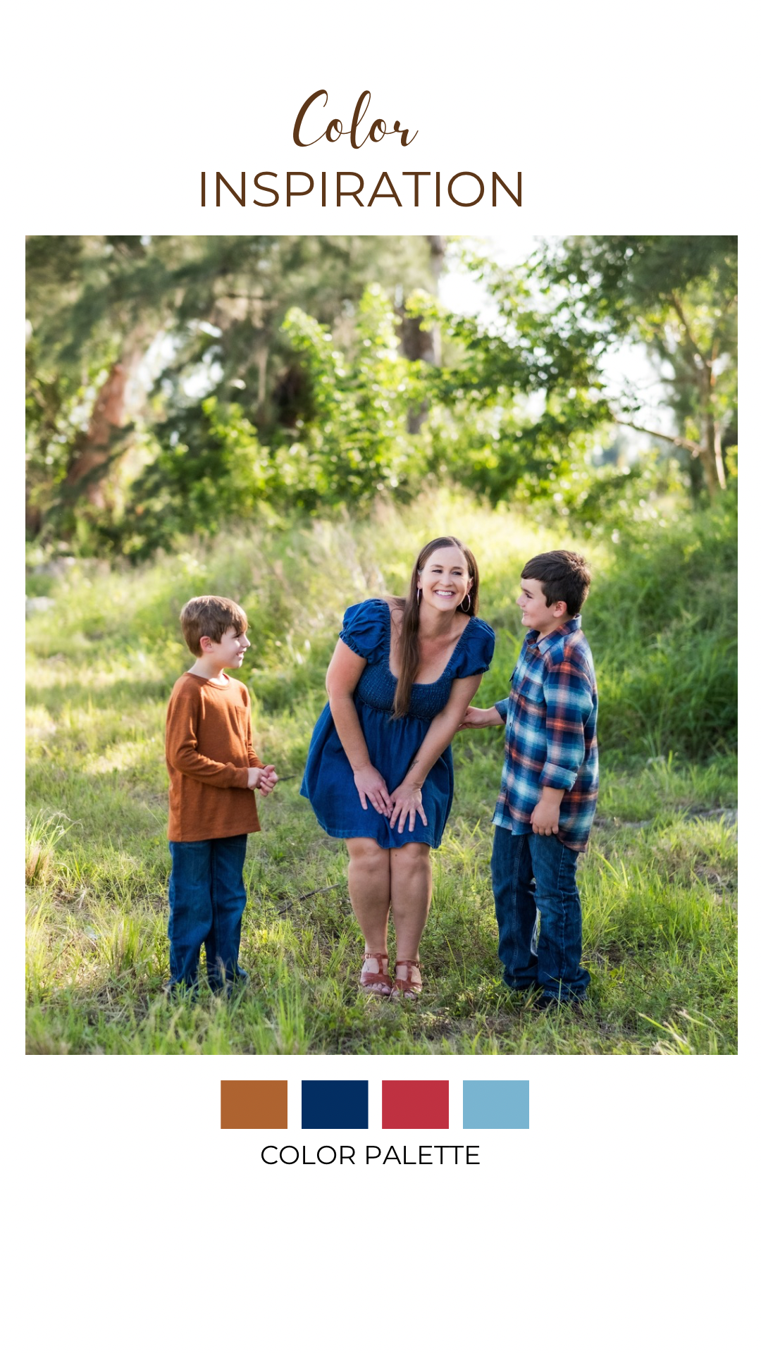 A woman with long brown hair in a blue dress smiling and interacting with two young boys in an outdoor green park setting. The boys are wearing plaid and brown shirts.