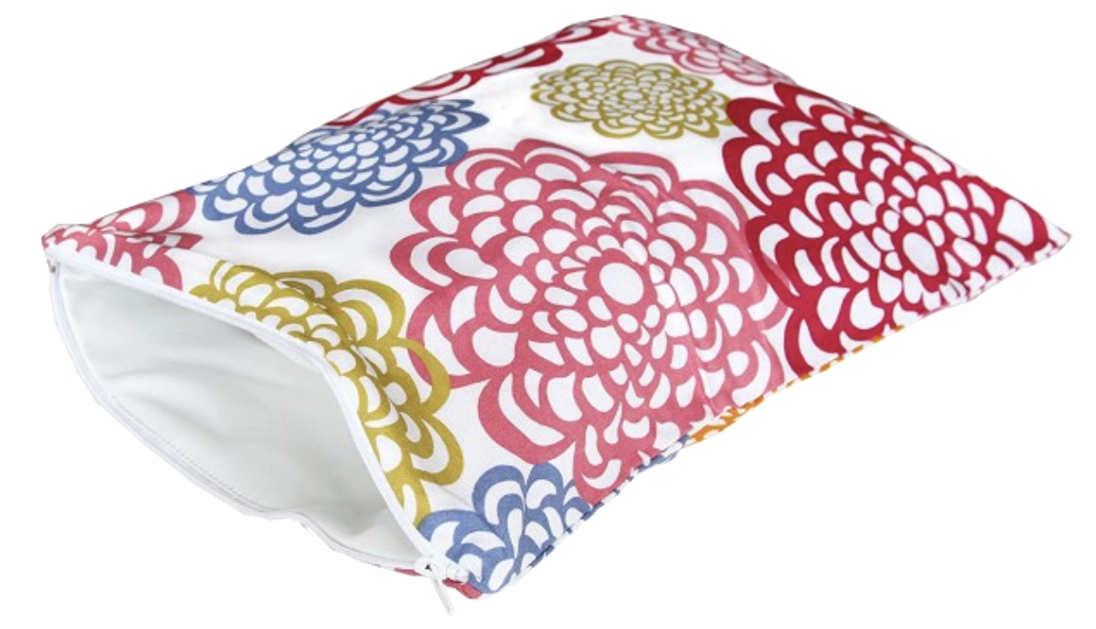 A decorative pillow with a white background and red, blue, and gold floral patterns.