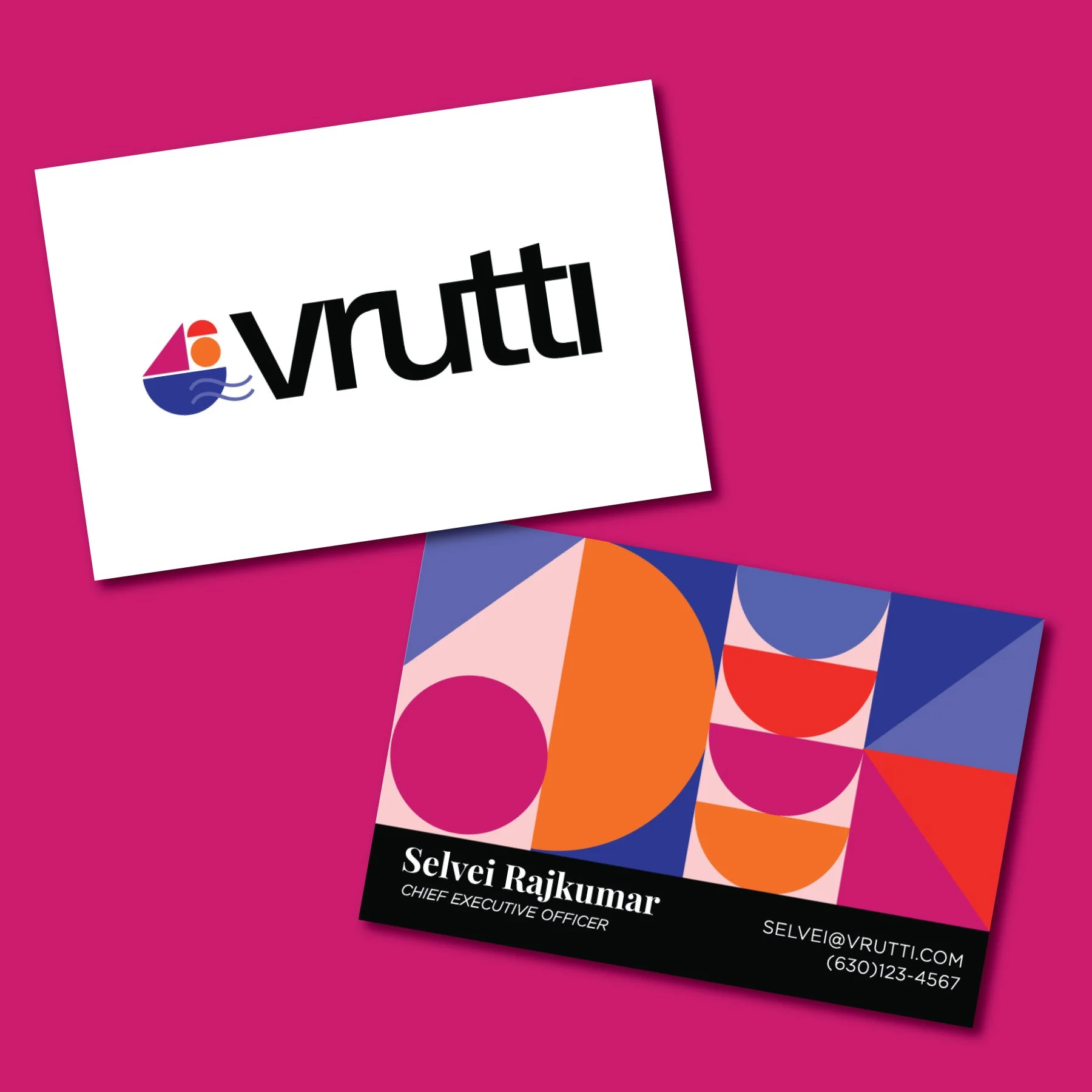 A business card for Selvei Rajkumar, Chief Executive Officer at Vrutti, featuring a colorful abstract geometric design and contact details, placed on a pink background alongside a white card with the Vrutti logo.