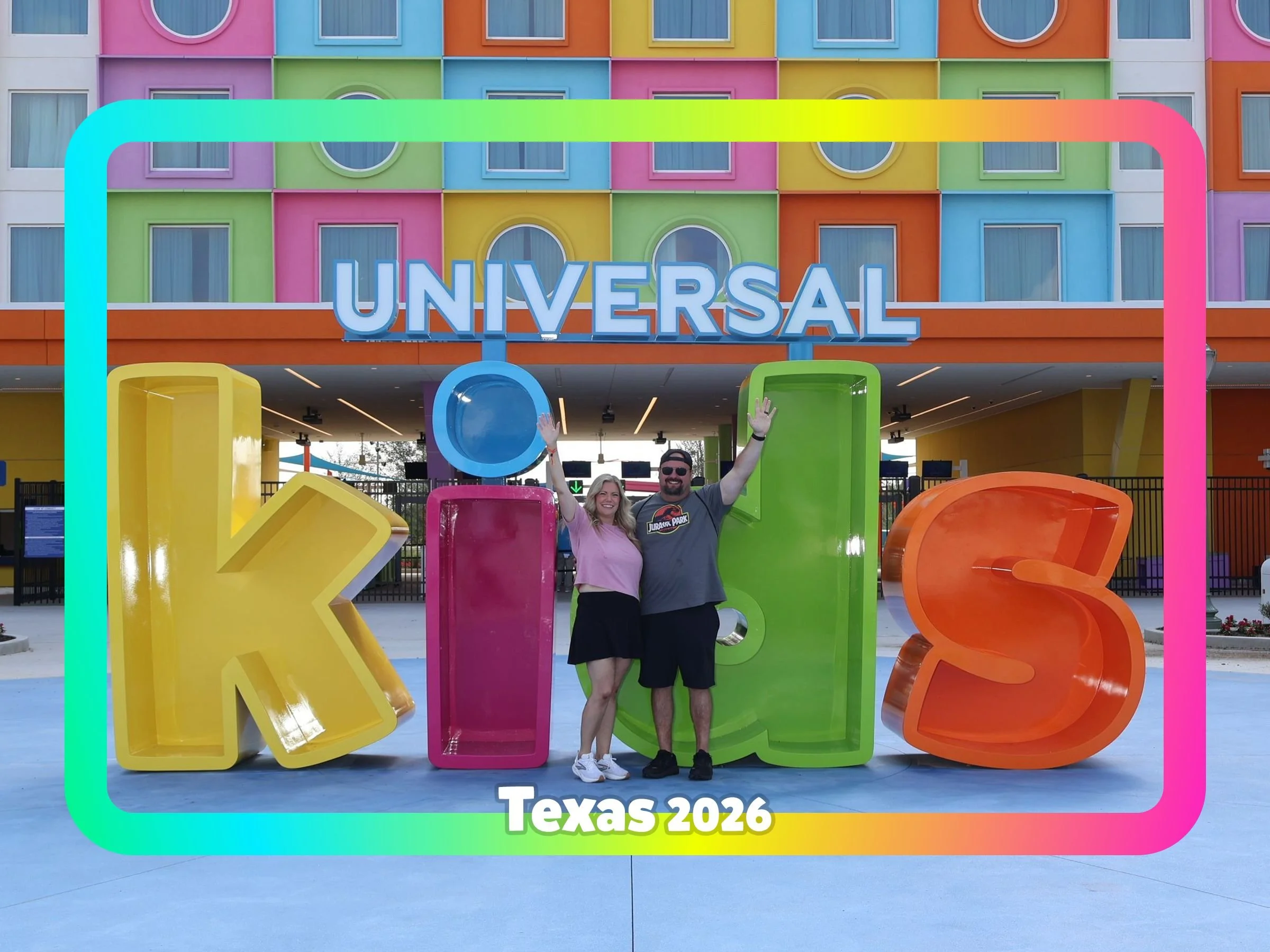 Family at the colorful entrance to Universal Kids Resort in Frisco, Texas