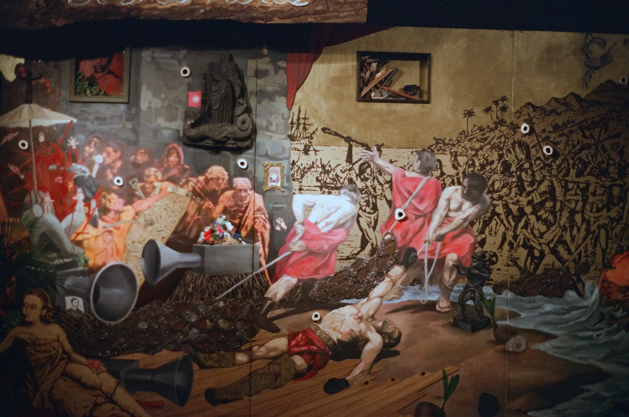 A mural depicting a chaotic scene with soldiers attacking and crowding around, with some people tied up and others holding weapons, in a historical or revolutionary setting.