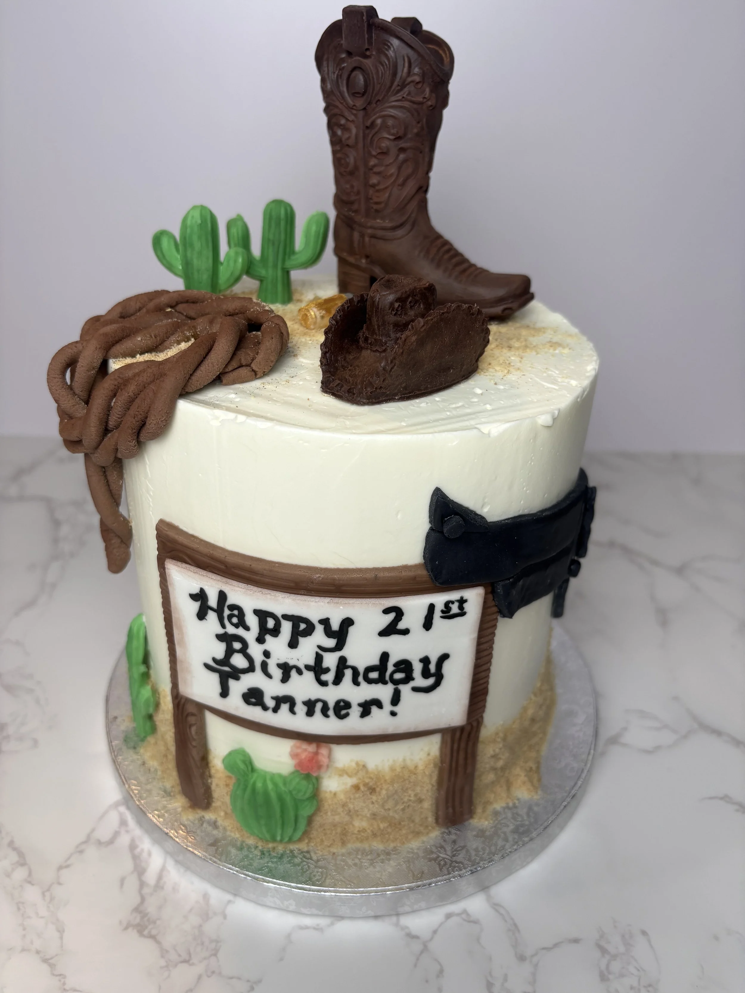 Custom Cowboy Cake, all decorations made from chocolate and/ or marshmallow fondant