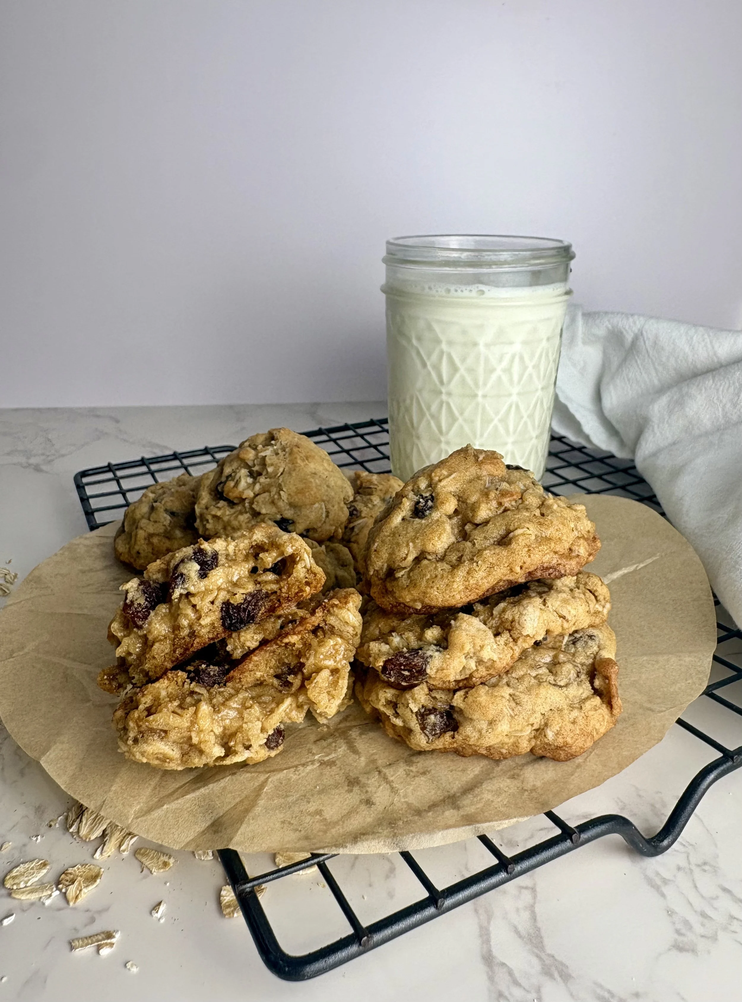 Now serving chewy oatmeal raisin cookies, a classic done right- thick, chewy oatmeal raisin cookies baked with warm cinnamon, buttery oats, and plump sweet raisins.