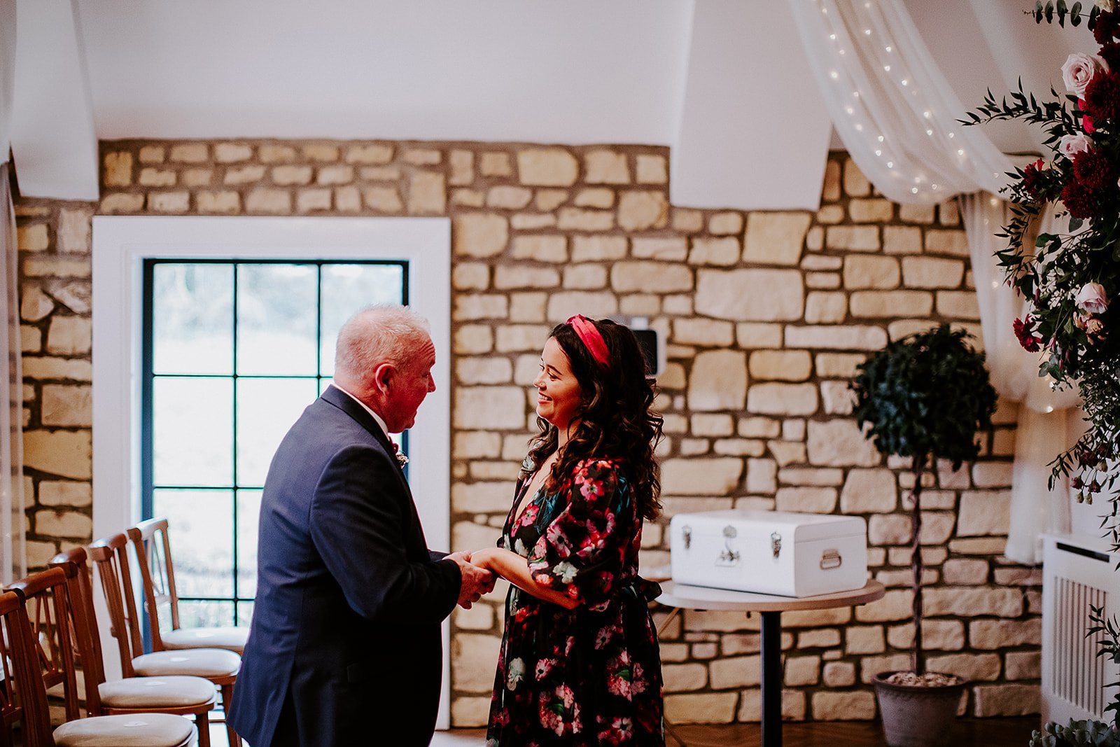 Guests smiling during a relaxed, personalised wedding ceremony led by UK celebrant