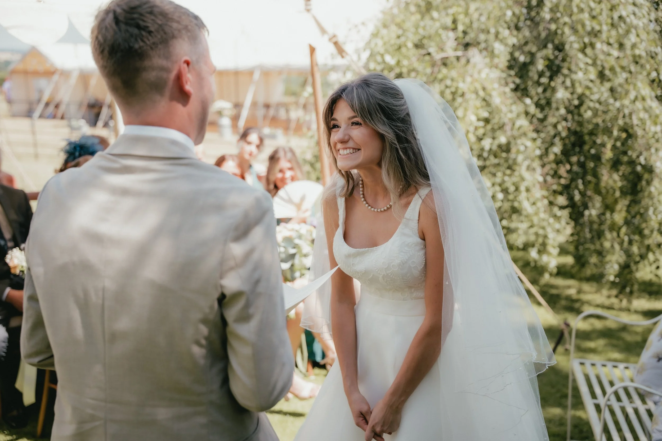 Couple laughing during a bespoke wedding ceremony with modern celebrant in the UK