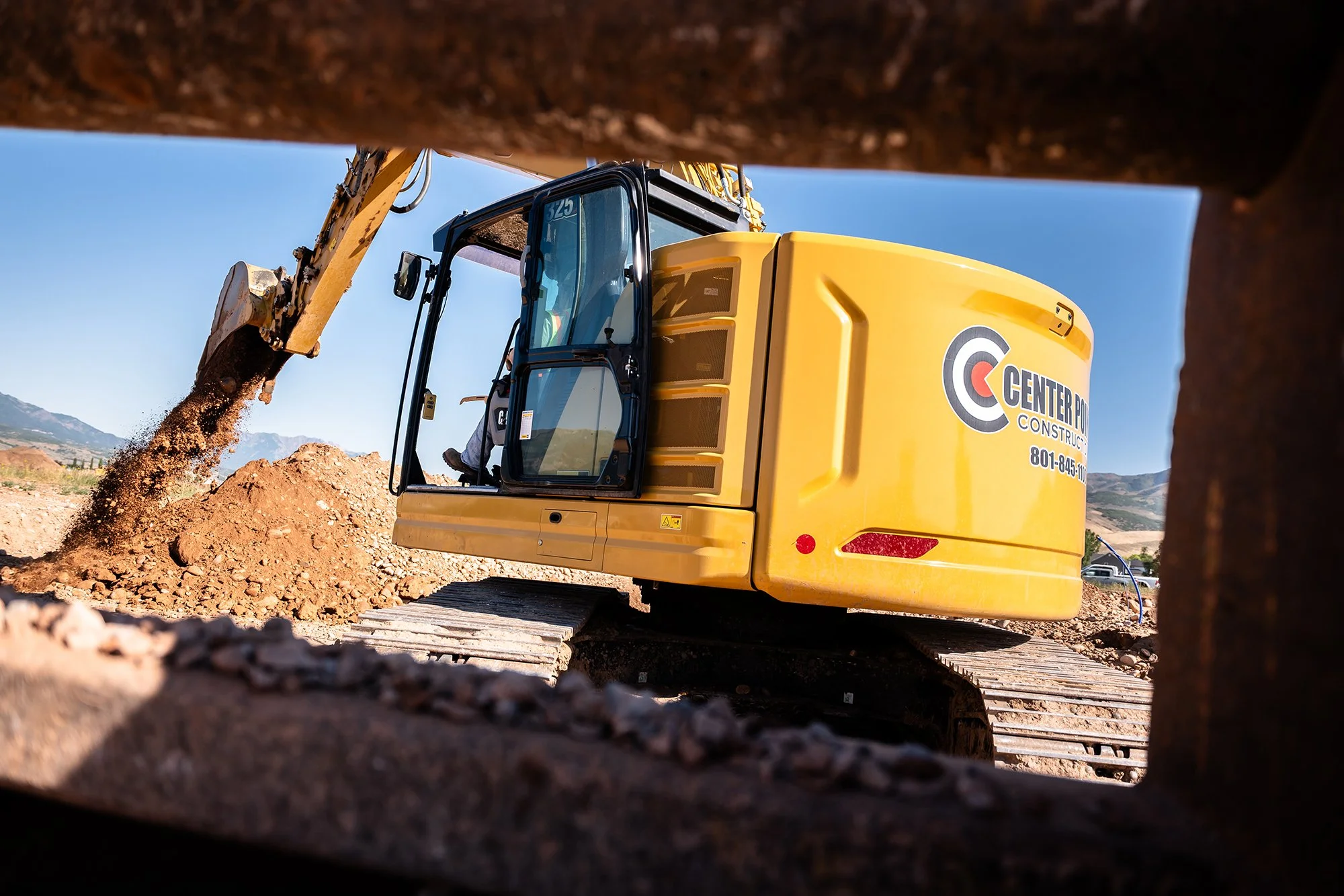 excavator digging trenches for underground utilities