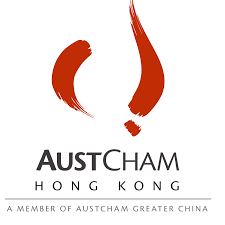 A logo with stylized red brush strokes resembling a flame or abstract shape, with the words 'AustCham Hong Kong' underneath and a tagline 'A Member of AustCham Greater China'.