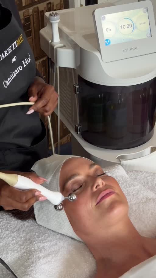 Guest enjoying an Aquapure facial treatment at Take Time