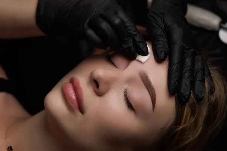 Brow treatment in progress at Take Time