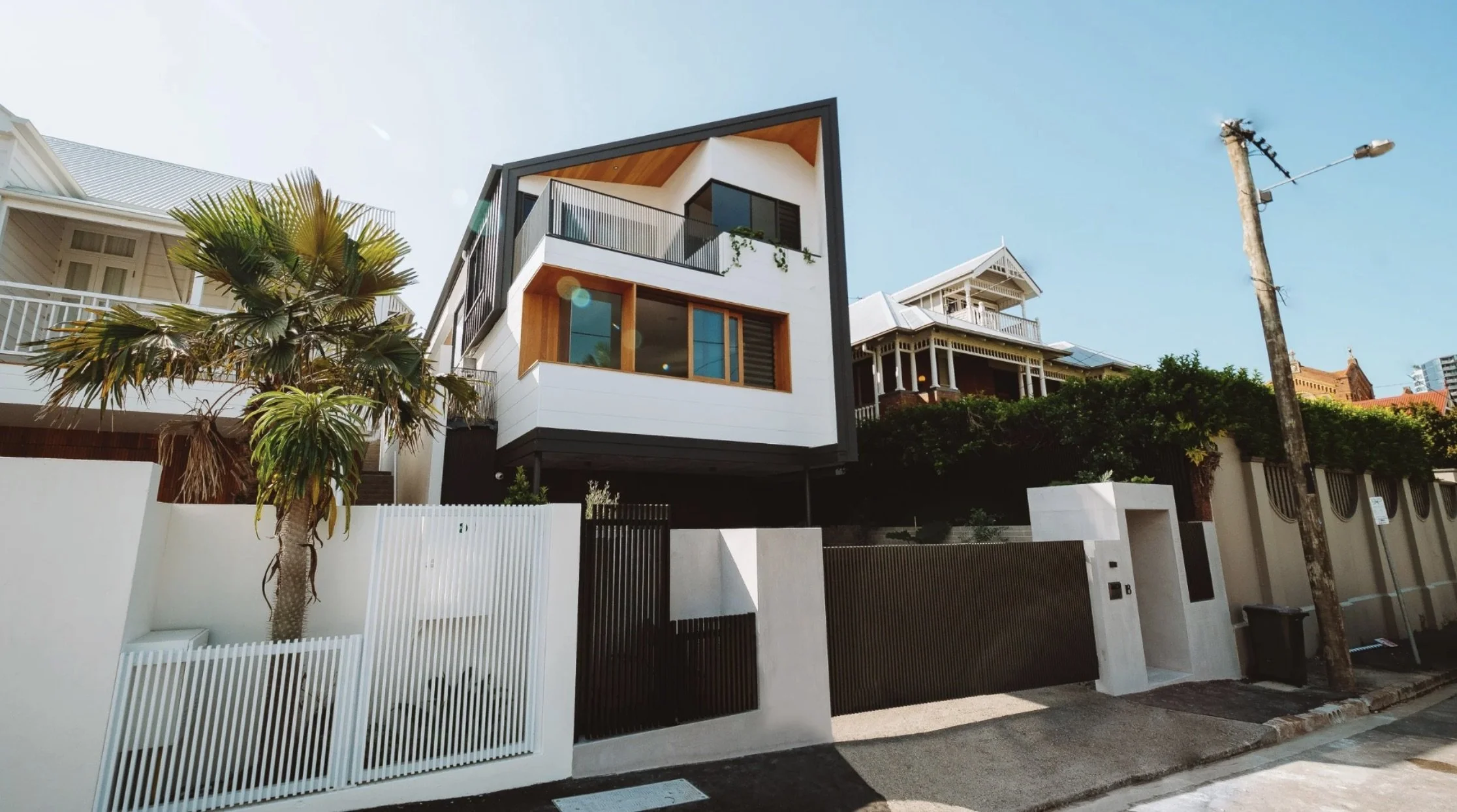 Modern multi-story house with large windows, in Spring Hill, Brisbane - by Primo Property group.