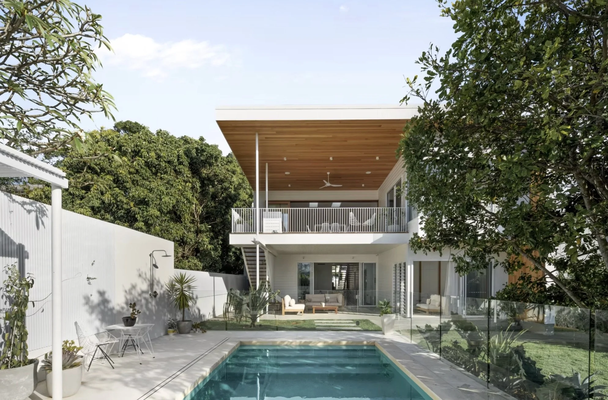 Modern backyard with a swimming pool, in Windsor, Brisbane - by Primo Property,