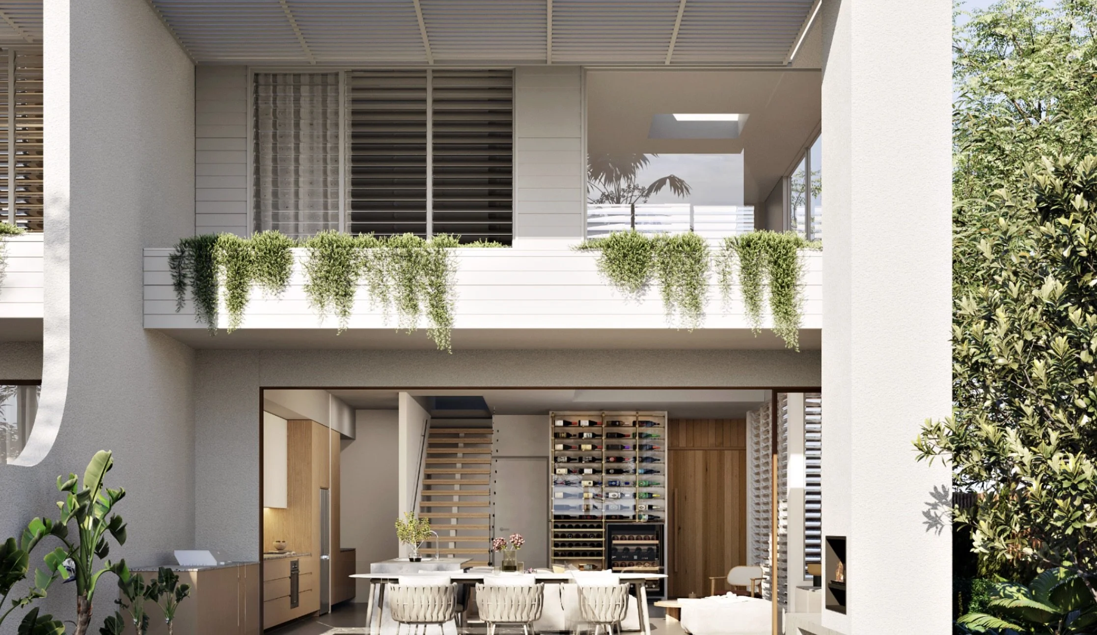 Modern two-story house with an open-concept kitchen and dining area on the ground floor, featuring a white dining table with six chairs, kitchen appliances, a wine storage, and decorative plants. The upper floor has a balcony with lush green hanging plants and large windows, with visible wooden blinds. The exterior includes white walls, vertical window blinds, and greenery outside.