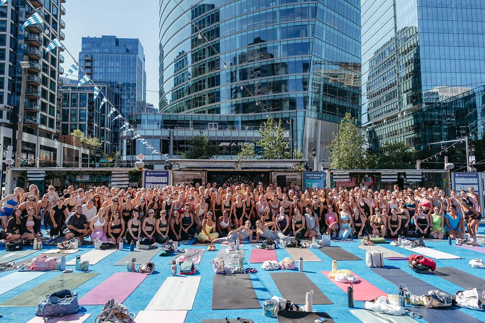 A beautiful outdoor yoga class in the Seaport district of Boston.
