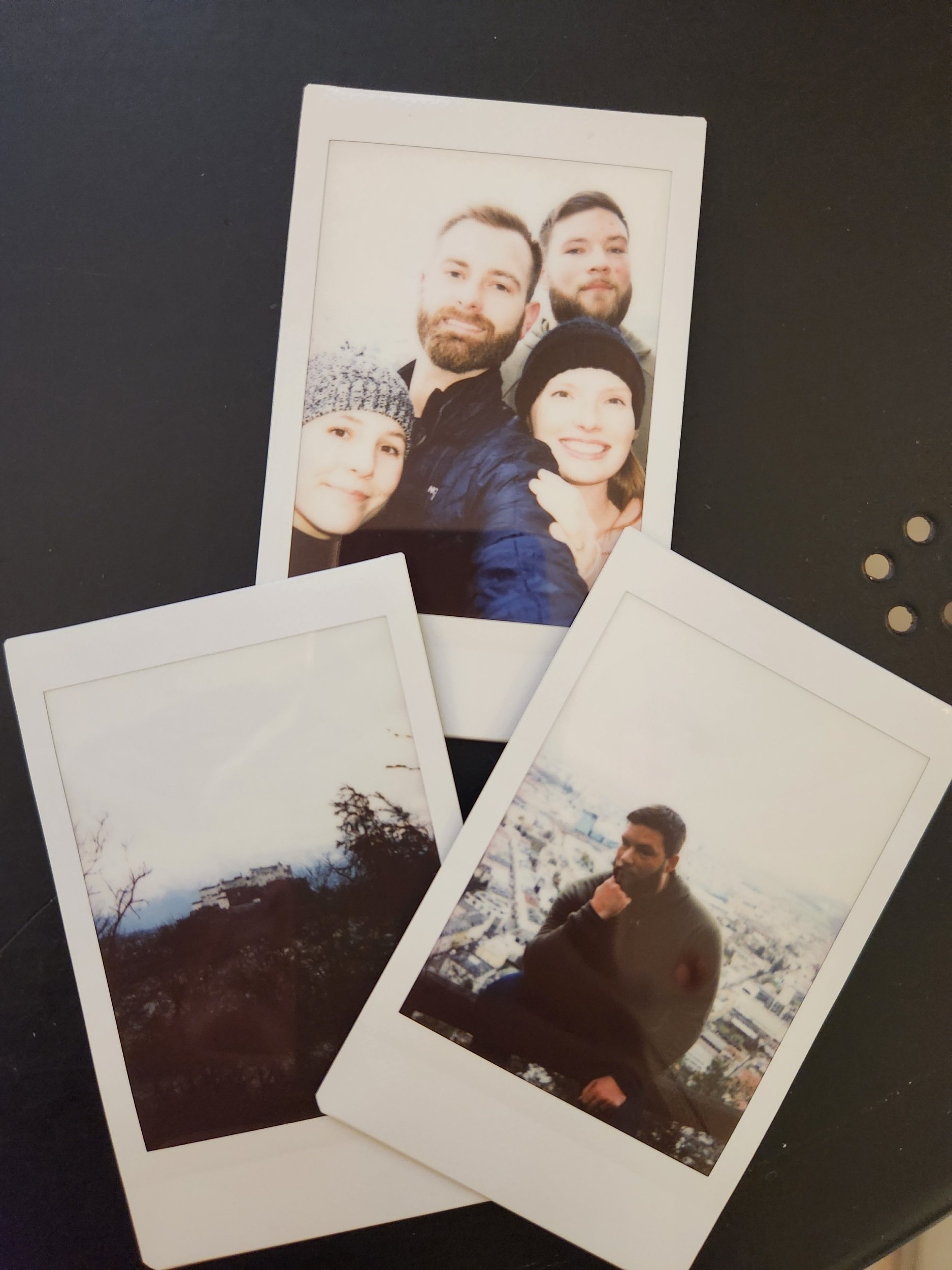Polaroid photos of Brooke, Nick, and friends from a trip together, including candid moments and a castle in one of the photos.