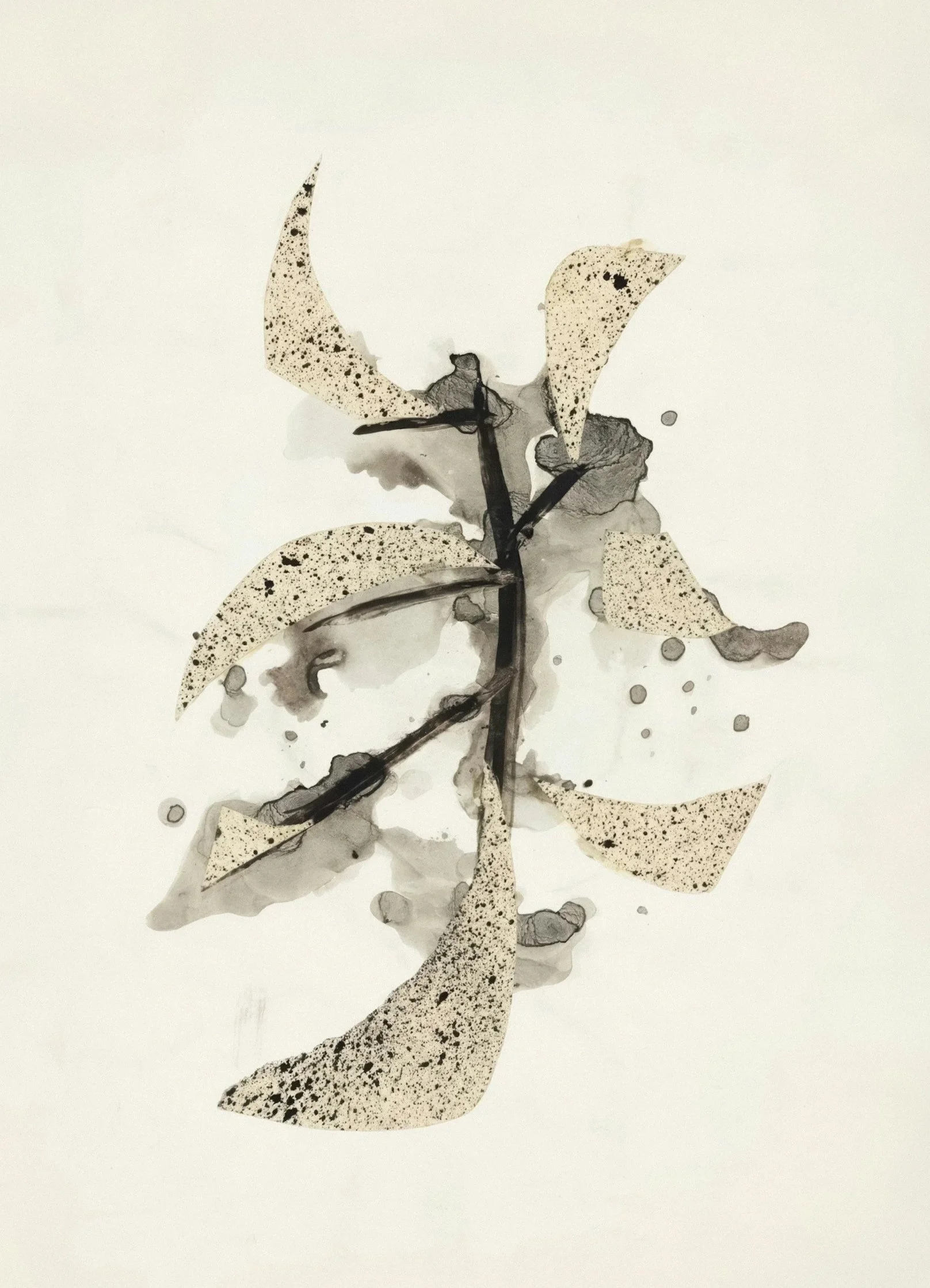 Abstract black and white ink painting on paper with textured torn paper pieces and ink splatters, resembling a flower or plant.