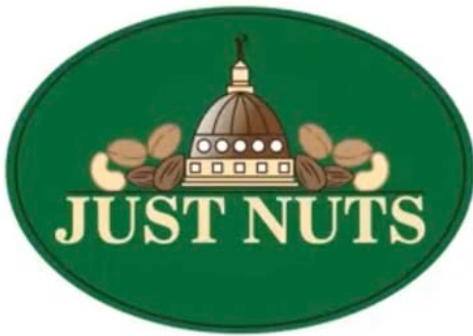 Logo with a green oval background featuring a Capitol building and various nuts, with the text 'JUST NUTS' below.