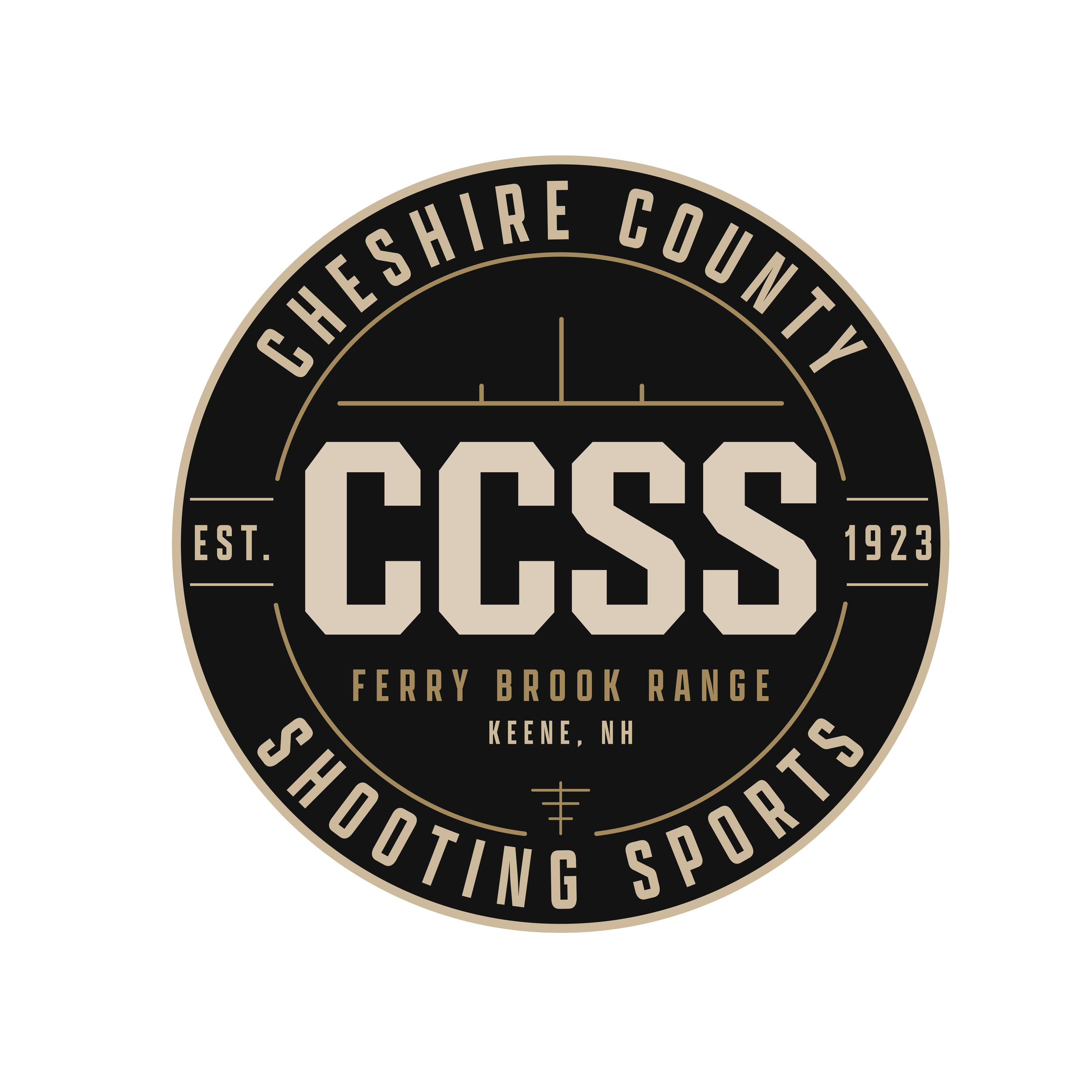 Close-up of a black circular emblem with beige text and design elements. The emblem features the words 'CHESHIRE COUNTY' at the top, 'FERRY BROOK RANGE' in the middle, and 'KEENE, NH' at the bottom. It also includes the establishment year '1923' and decorative lines and geometric shapes.