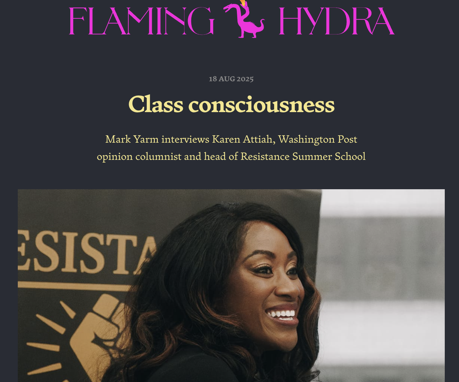 The image shows a smiling Black woman with wavy hair, sitting in front of a banner with the word ‘Resistance’ on it, during an interview or event at the Flaming Hydra platform.