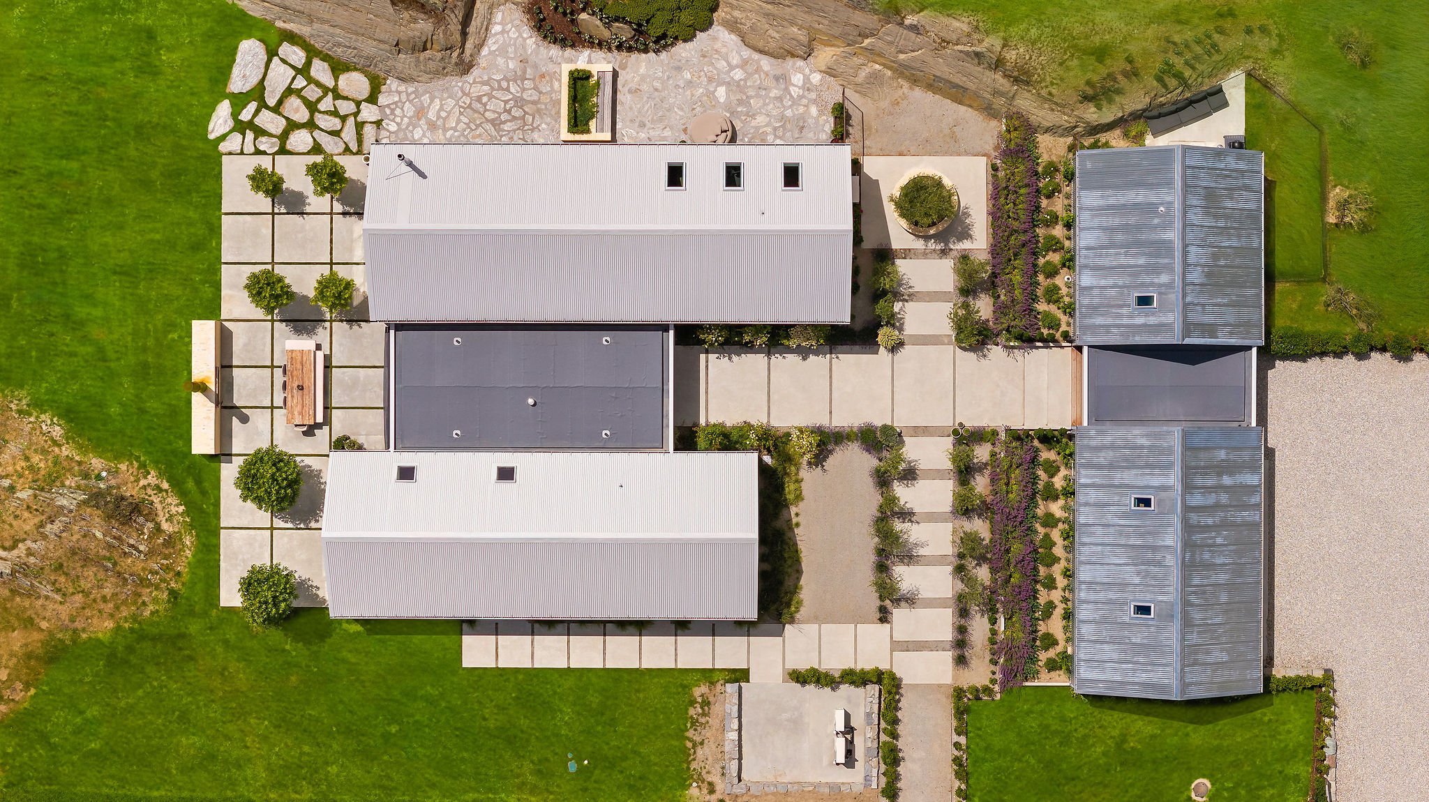 A drone shot looking down on Peregine Ridge, a Gibbston Valley home built by Diemarco Builders Queenstown.