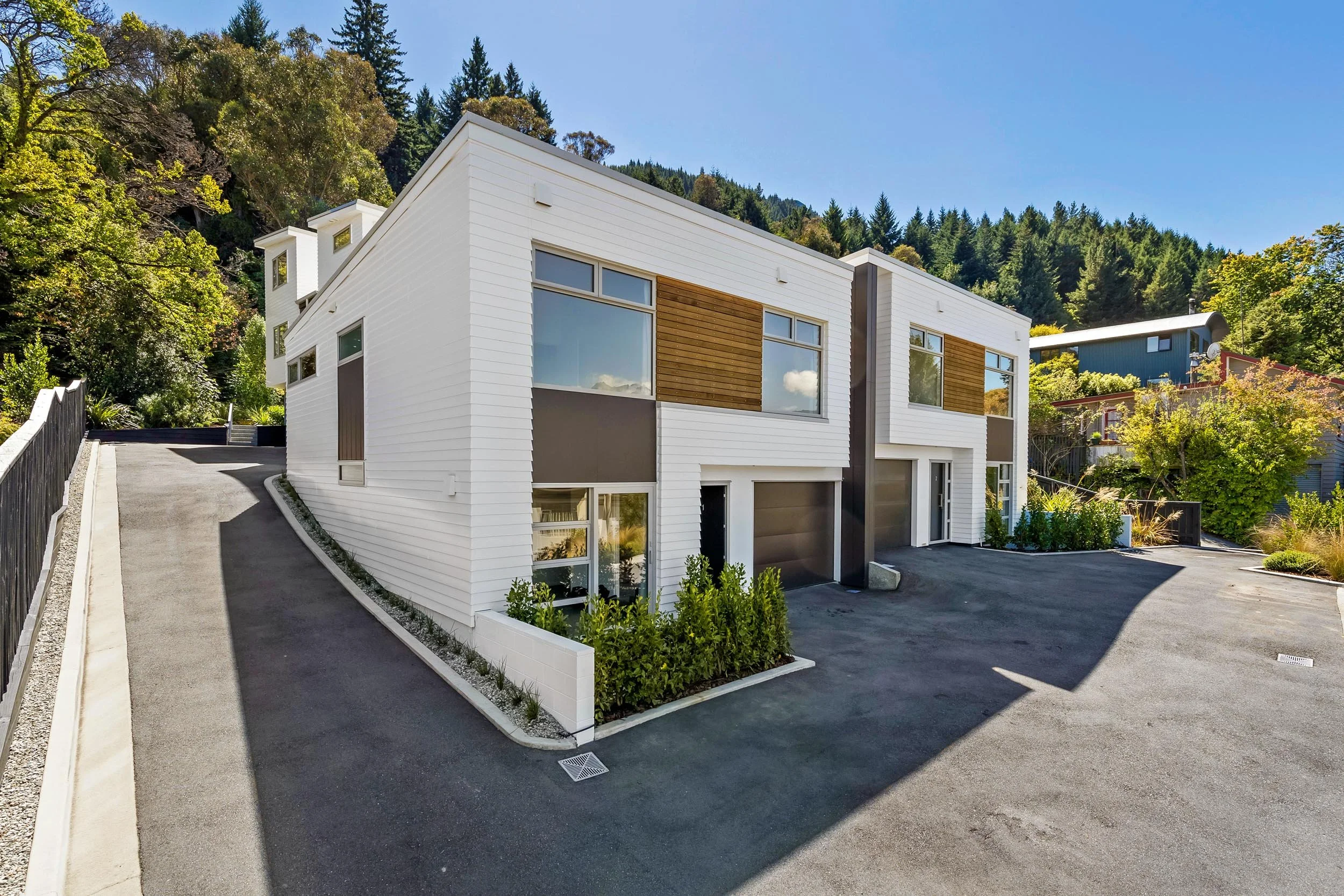 The completely refreshed exterior of renovated townhouses by the team at Diemarco Builders Queenstown.
