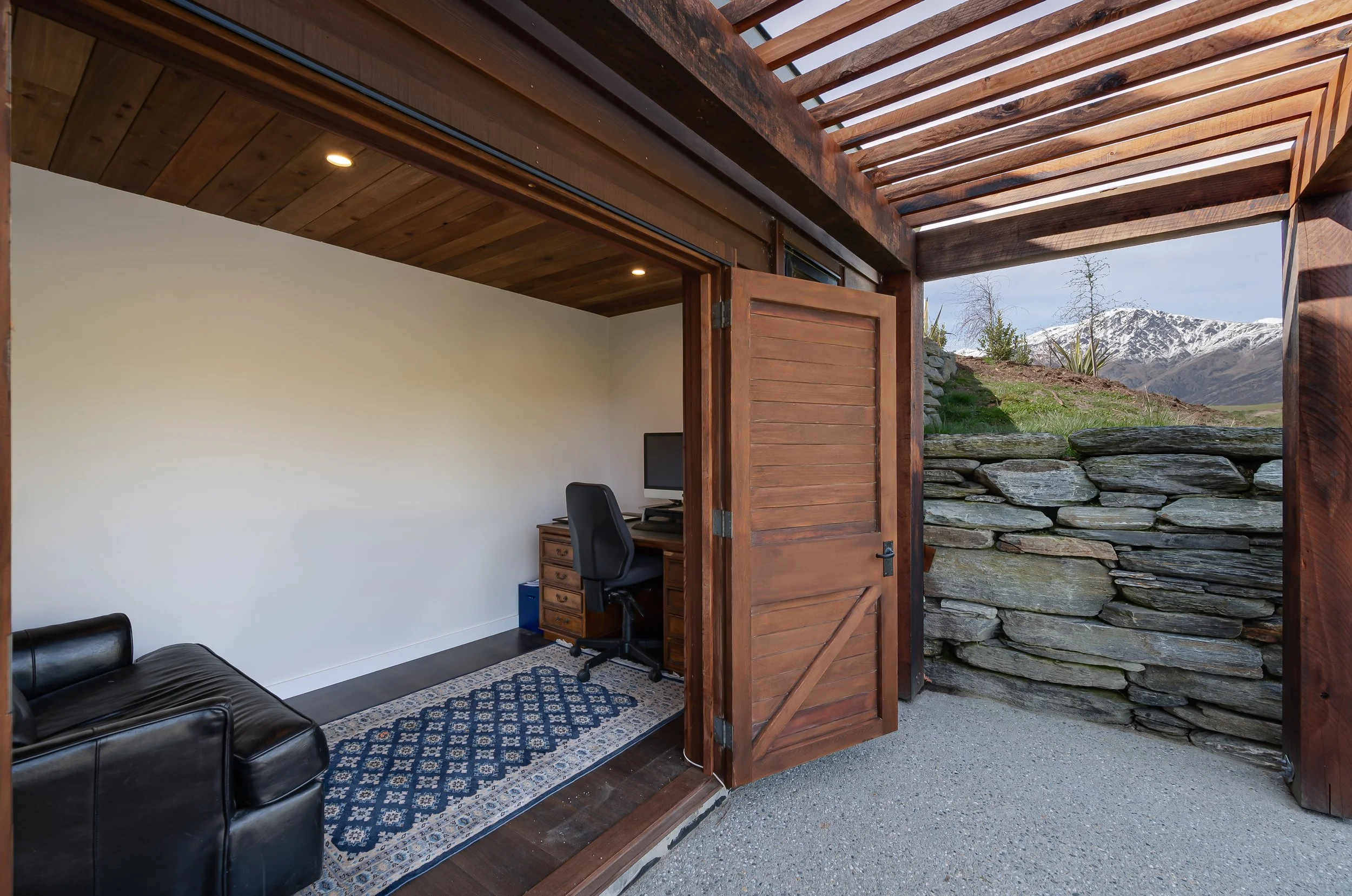 Timber fold away doors to an office nook at a new home build in Threepwood by Diemarco Builders Queenstown.