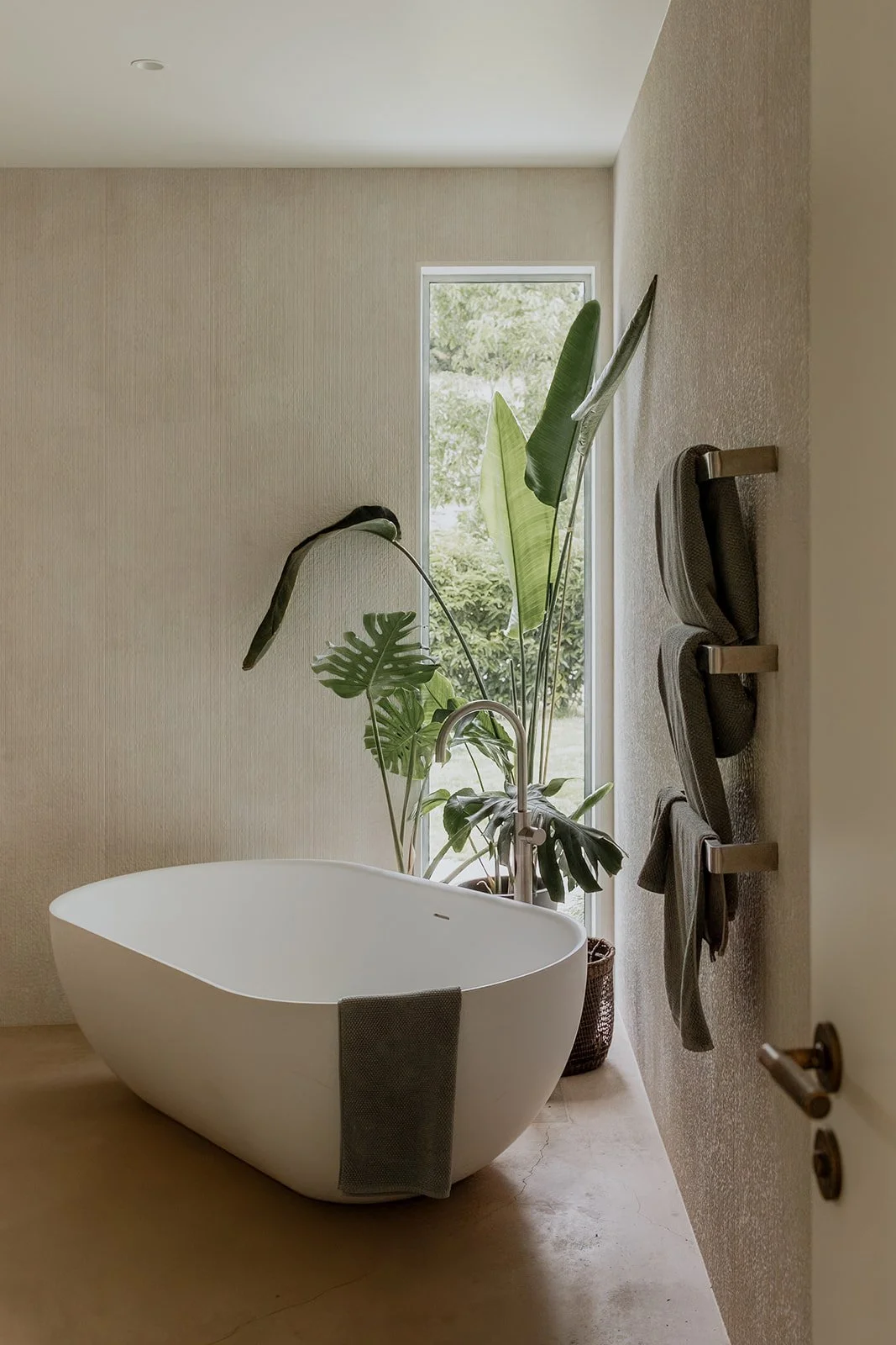 A statement bathtub in a designer bathroom built by Diemarco Builders Queenstown.