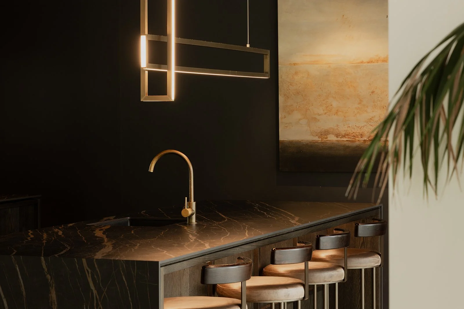 A dark moody kitchen in an architectural build by Diemarco Builders Queenstown.