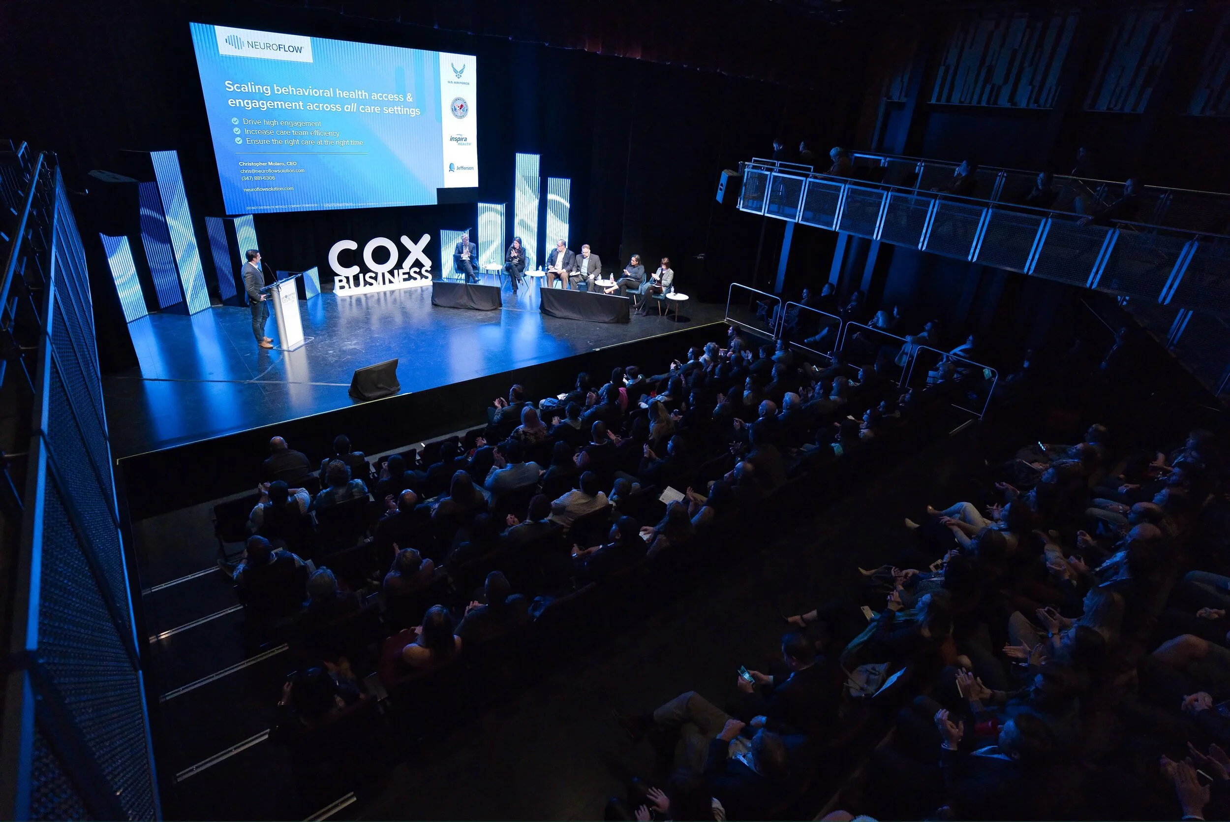 Conference event with panelists on stage in Kalispell, Montana in the Flathead Valley