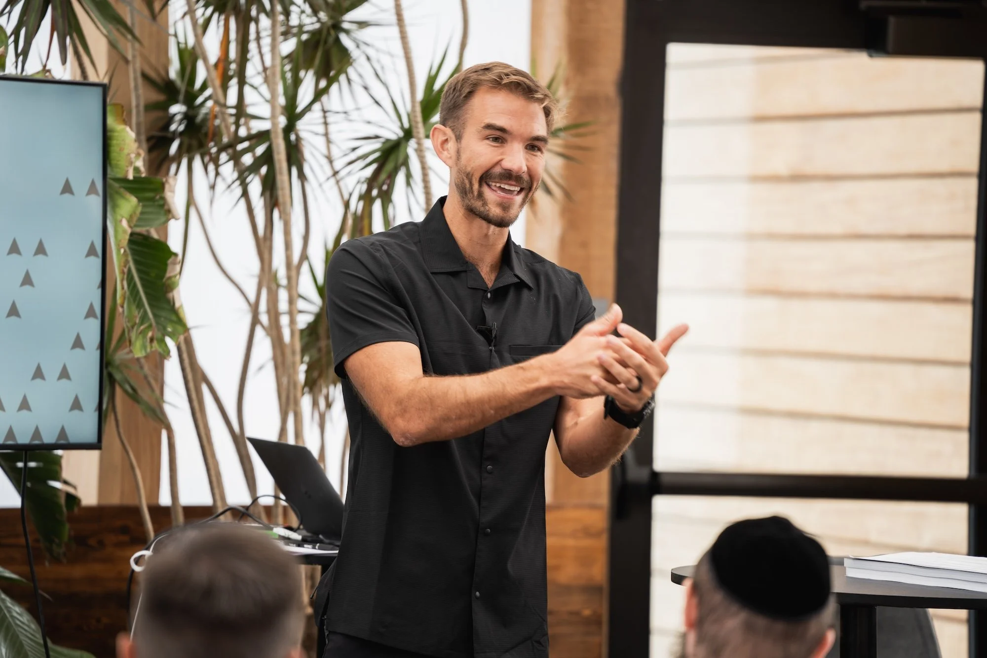 Man speaking energetically during a presentation, in Kalispell, Montana in the Flathead Valley