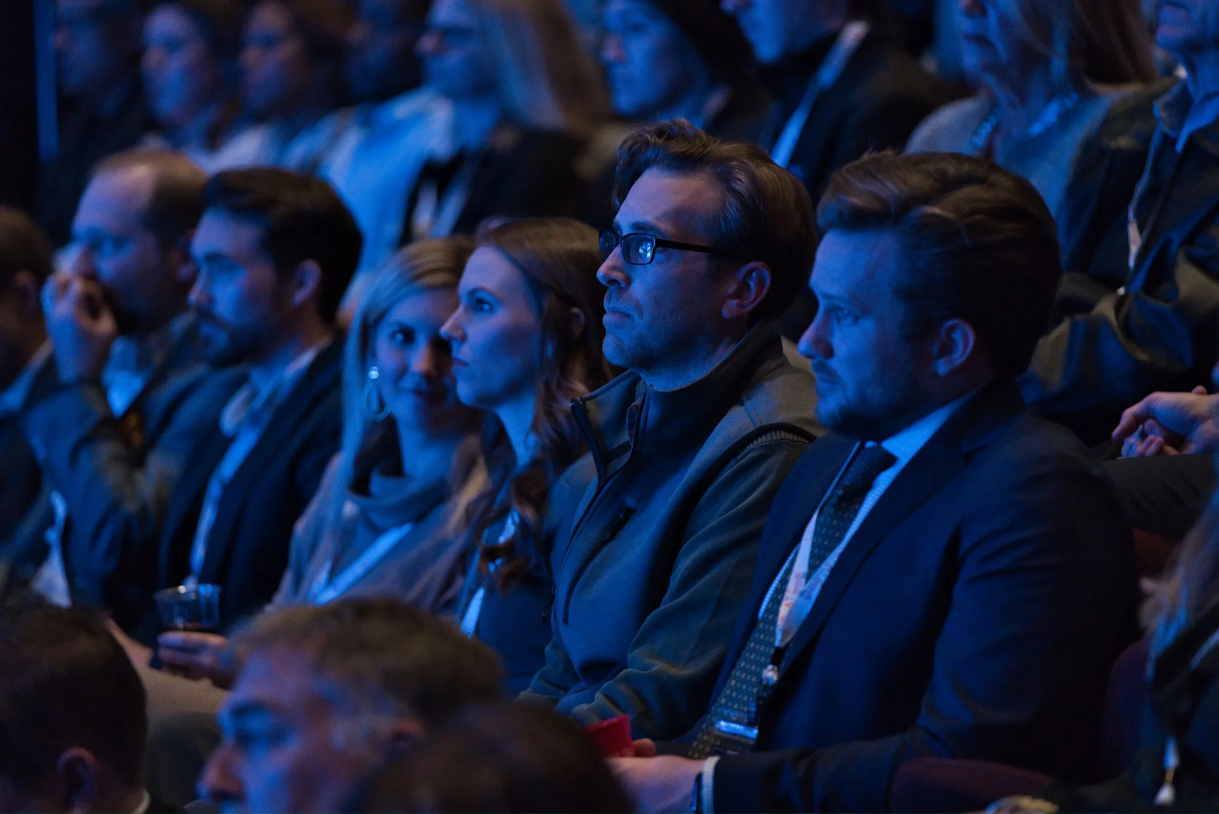 Audience members sitting in a conference hall in Kalispell, Montana in the Flathead Valley