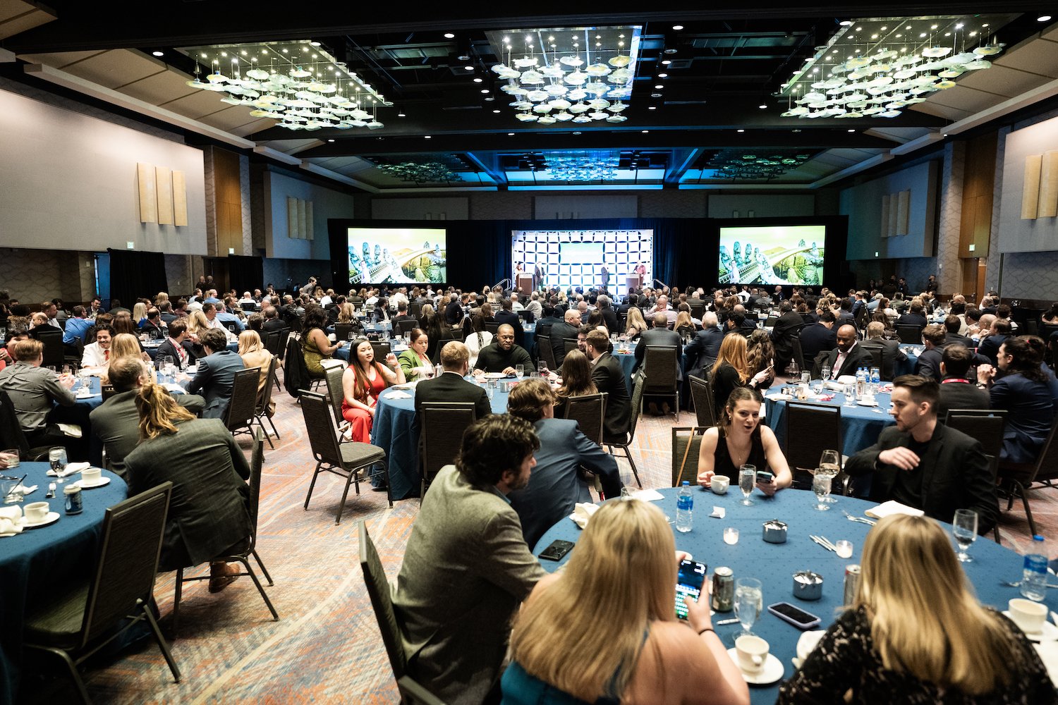 Large banquet hall filled with people seated at tables in Kalispell, Montana in the Flathead Valley