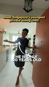 A young boy in a kitchen with text overlay saying 'Meet Singapore's youngest private dining chef!' and 'He is only 20 years old'.