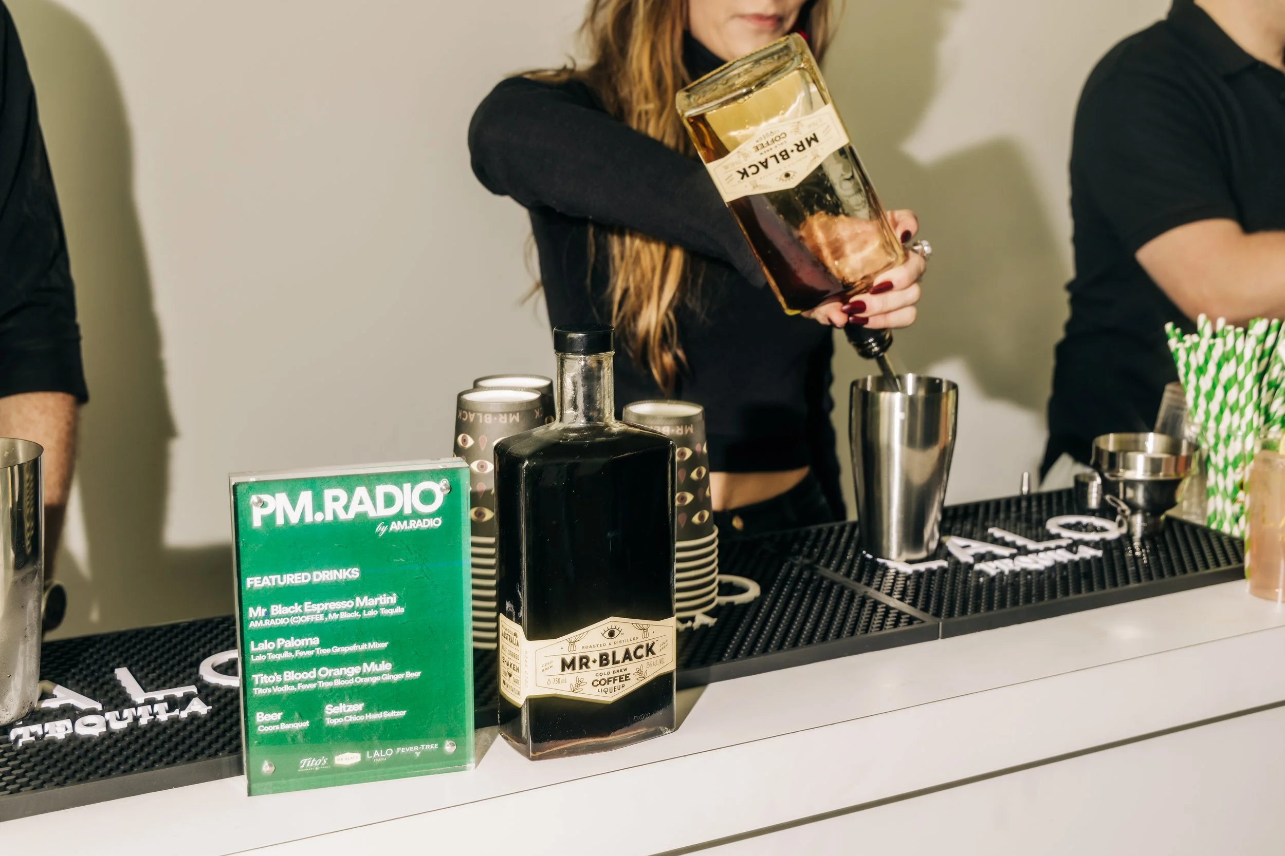 Bartender pouring Mr Black cocktails at The Lofts Venice Beach event